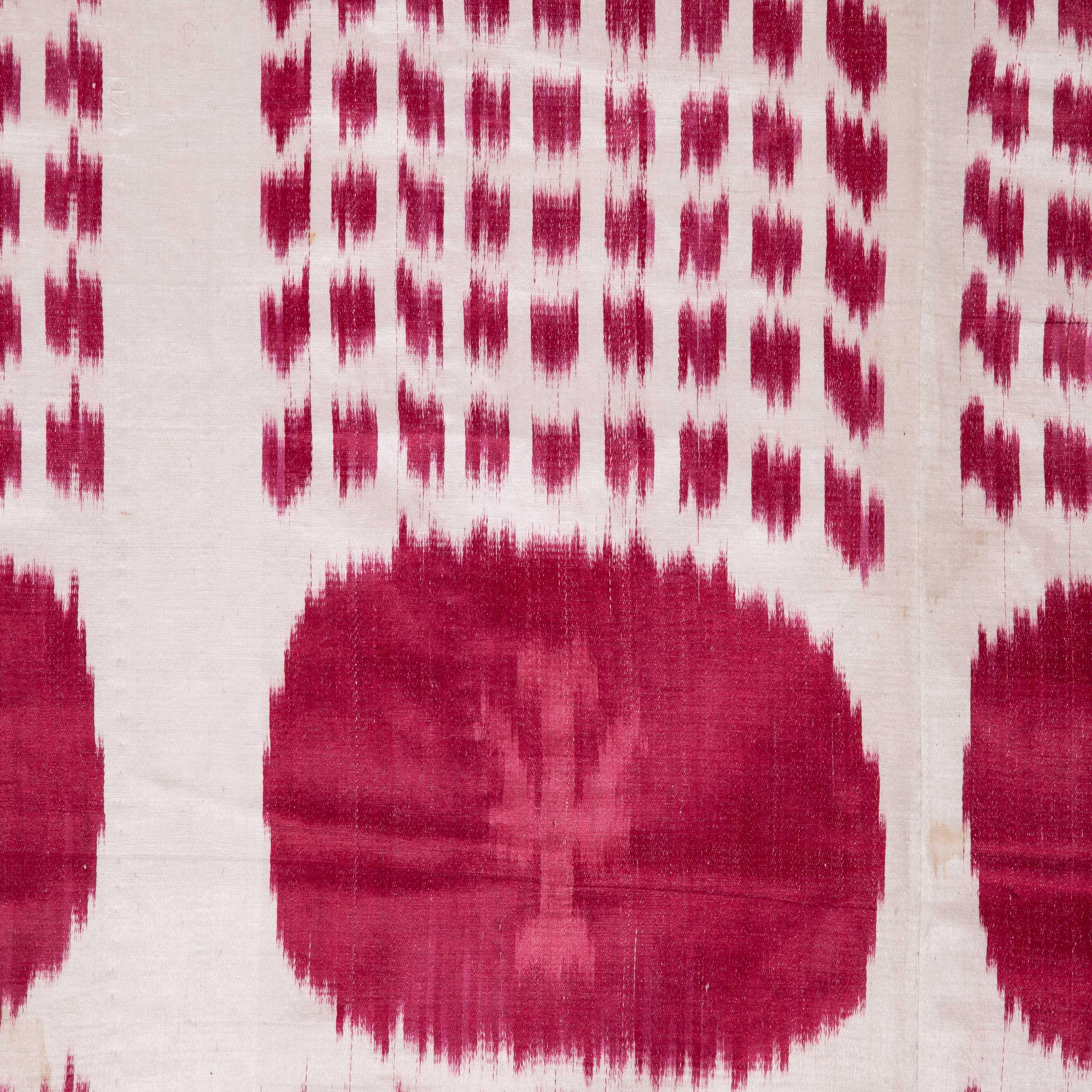This is a satin weave ikat in silk and cotton, with a very simple, graphic drawing. Lined with plain cotton fabric.
   