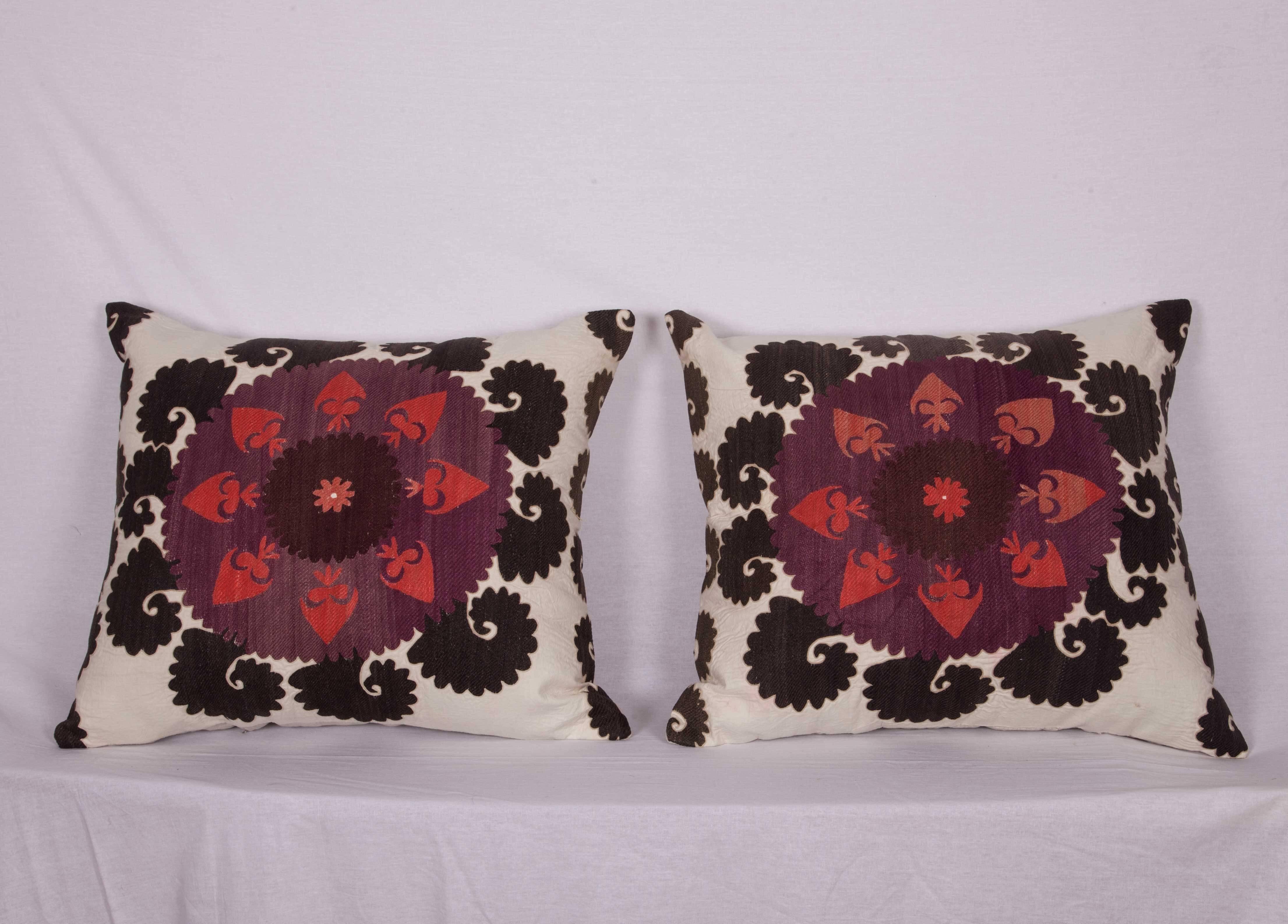 The pillow cases are made out of a mid-20th century, Uzbek Samarkand Suzani. They do not come with an insert but they come with a bag made to the size and out of cotton to accommodate the filling. The backing is made of linen. Please note filling is