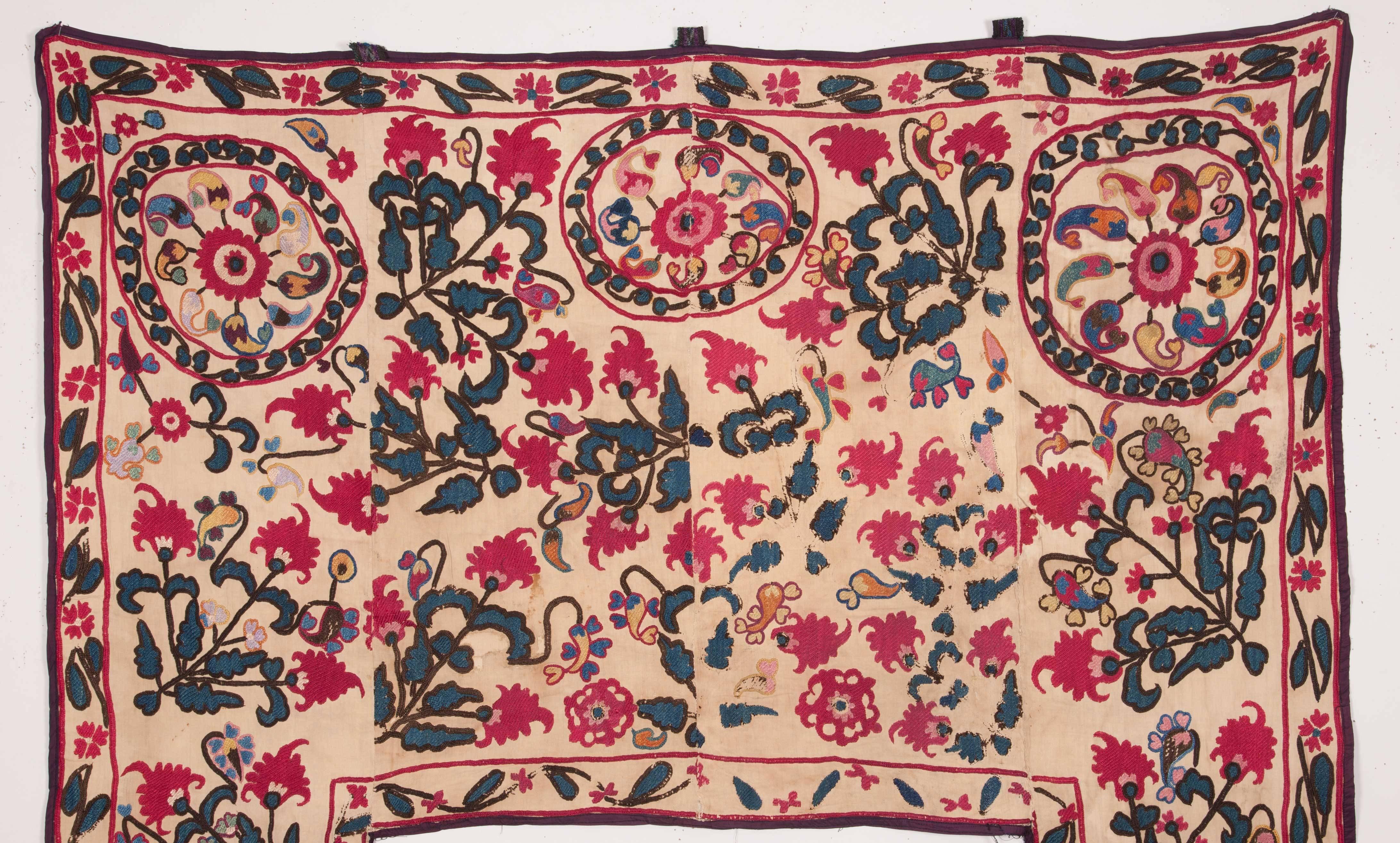 A naively drawn but professionally embroidered silk Suzani from Tajikistan.