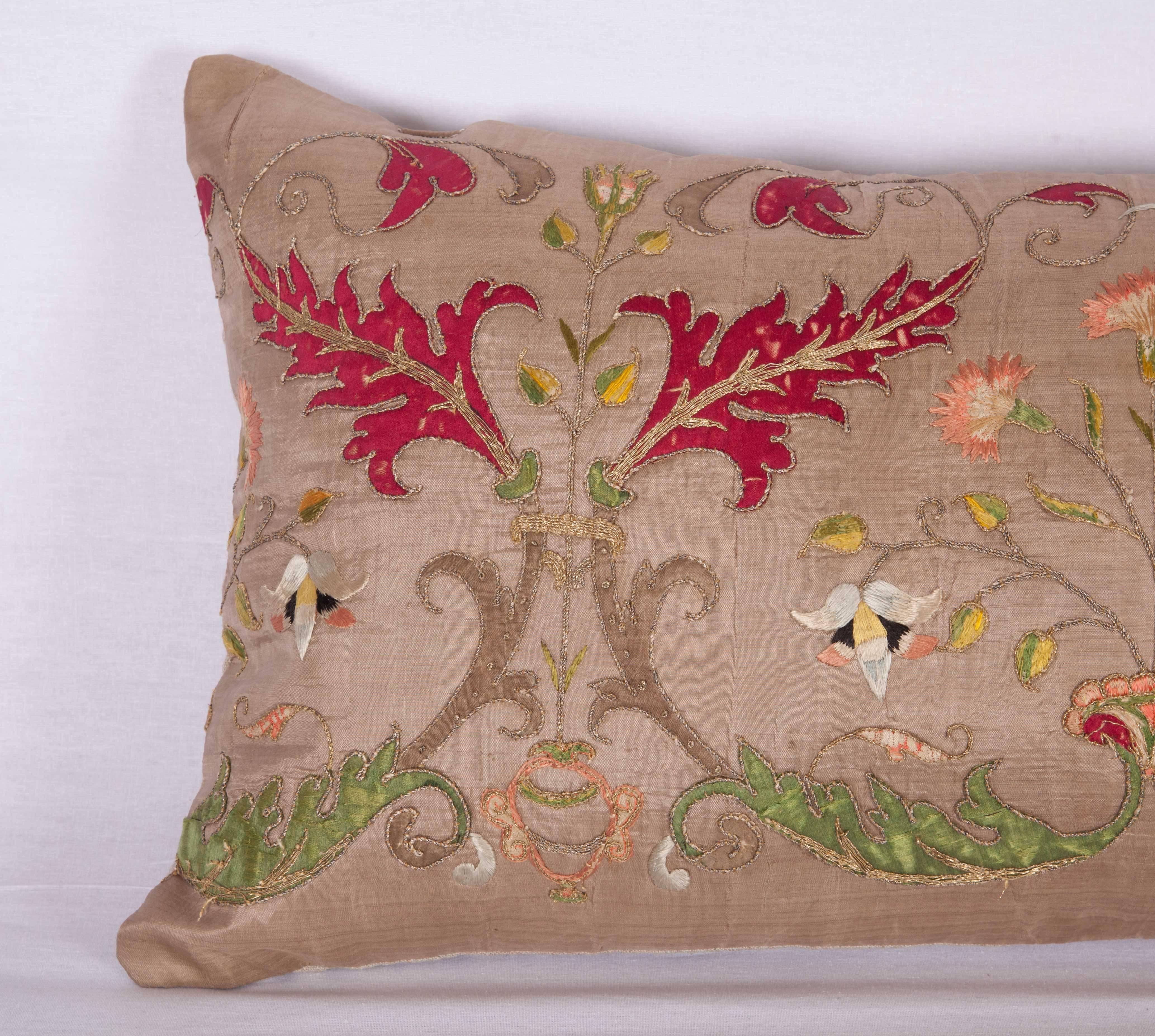 The pillow case is made out of a 17th or 18th century Italian silk applique and embroidered panel. It does not come with an insert but it comes with a bag made to the size and out of cotton to accommodate the filling. The backing is made of linen.