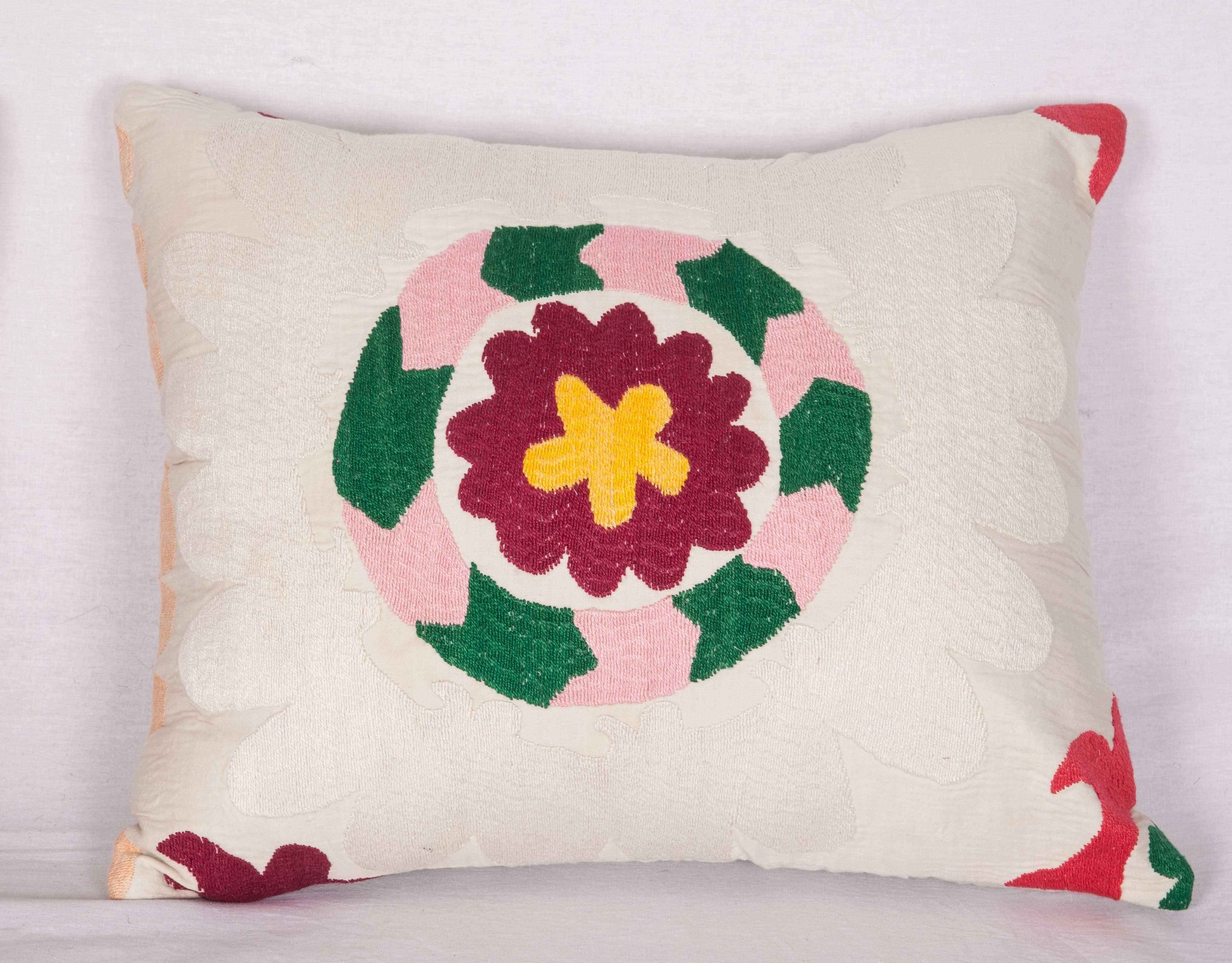The pillows are made out of vintage Tajik Suzani. They do not come with an insert but they come with a bag made to the size and out of cotton to accommodate the filling. The backing is made of linen. Please note filling is not provided. Since the