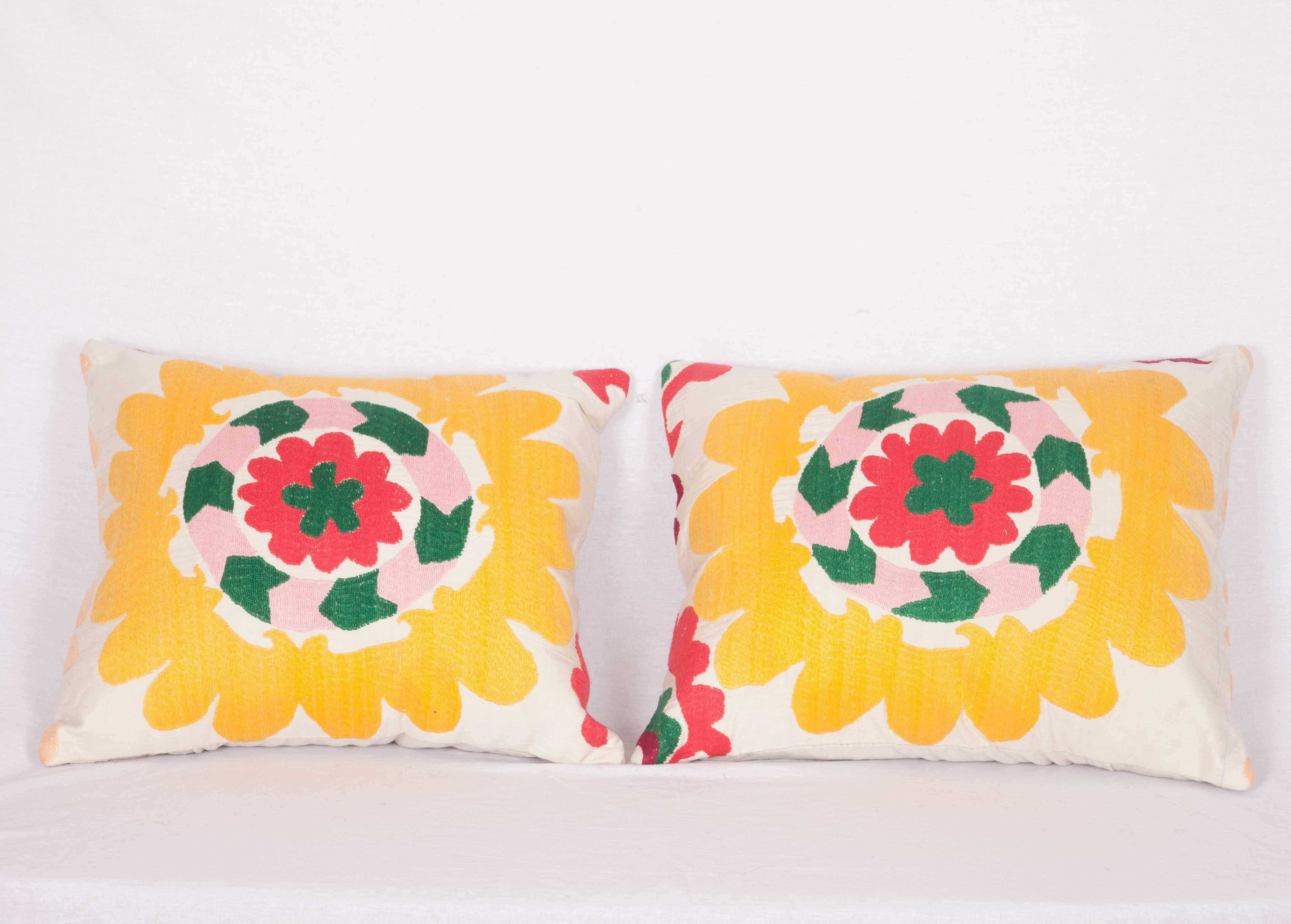 The pillows are made out of vintage Tajik Suzani. They do not come with an insert but they come with a bag made to the size and out of cotton to accommodate the filling. The backing is made of linen. Please note filling is not provided. Since the
