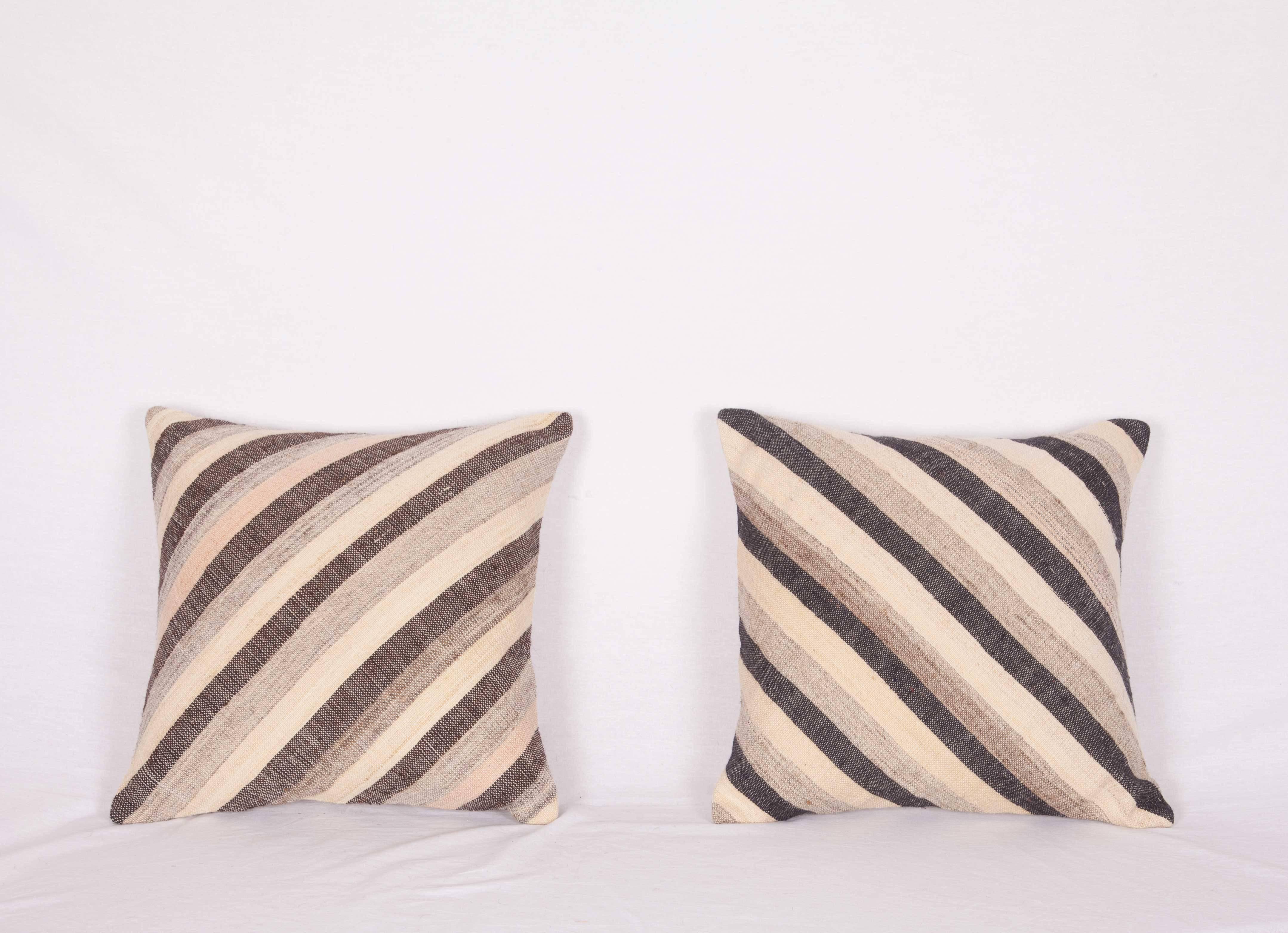 The pillows are made out of a mid-20th century, Turkish Kilim. They do not come with an insert but they come with a bag made to the size and out of cotton to accommodate the filling. The backing is made of linen. Please note filling is not provided.