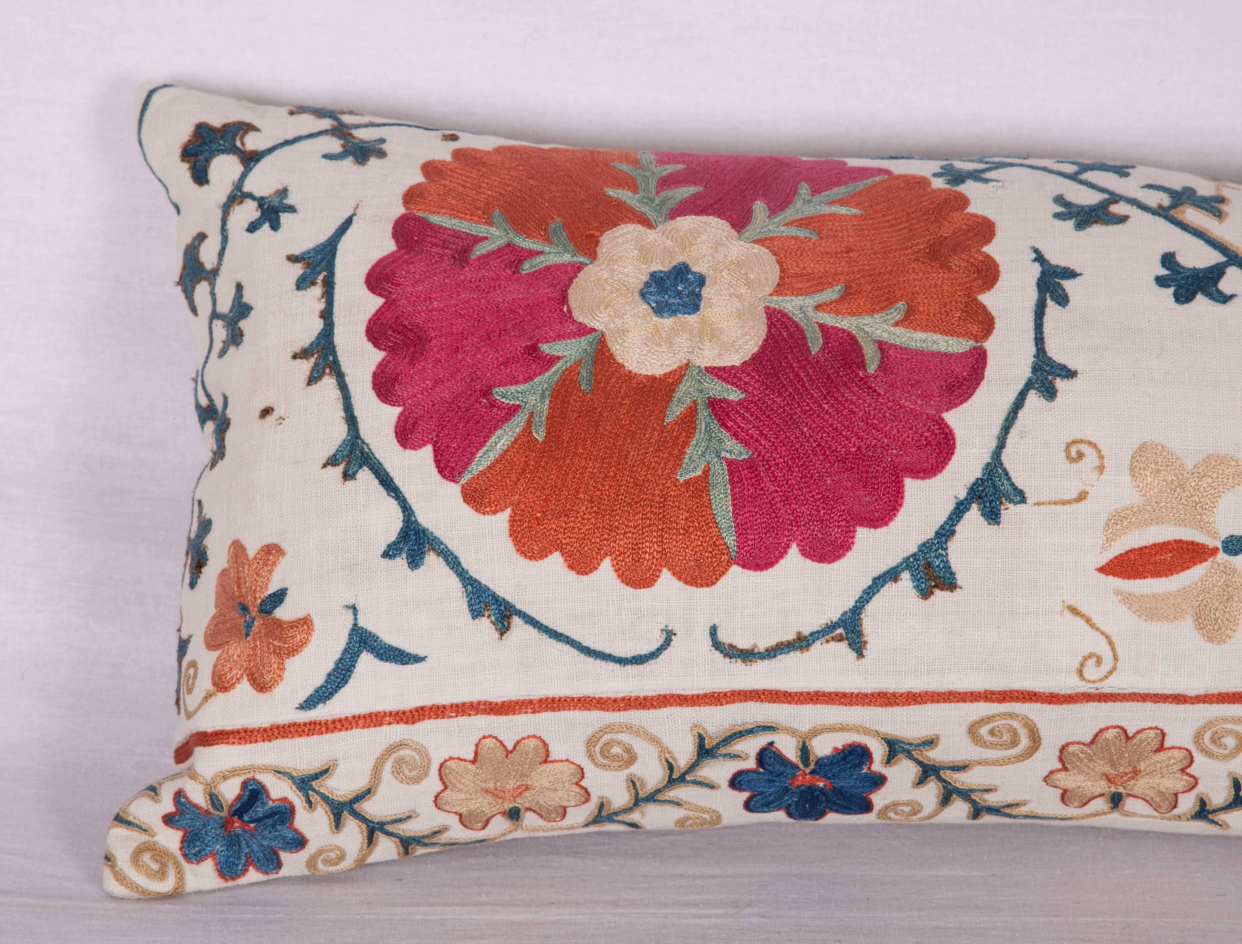 The pillow is made out of a 19th century, Uzbek Bukhara Suzani. It does not come with an insert but it comes with a bag made to the size and out of cotton to accommodate the filling. The backing is made of linen. Please note ' filling is not