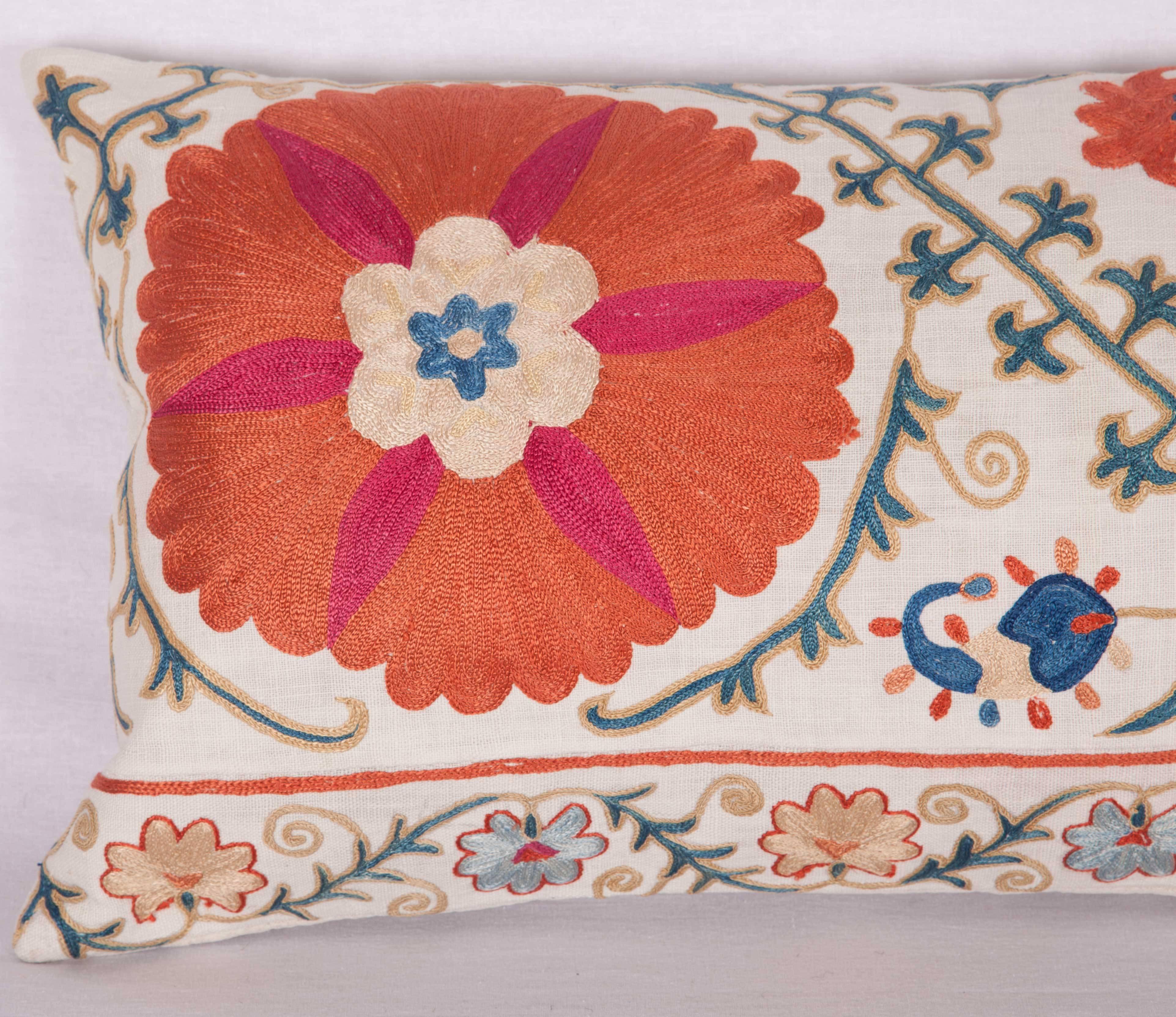 The pillow is made out of a 19th century, Uzbek Bukhara Suzani. It does not come with an insert but it comes with a bag made to the size and out of cotton to accommodate the filling. The backing is made of linen. Please note ' filling is not