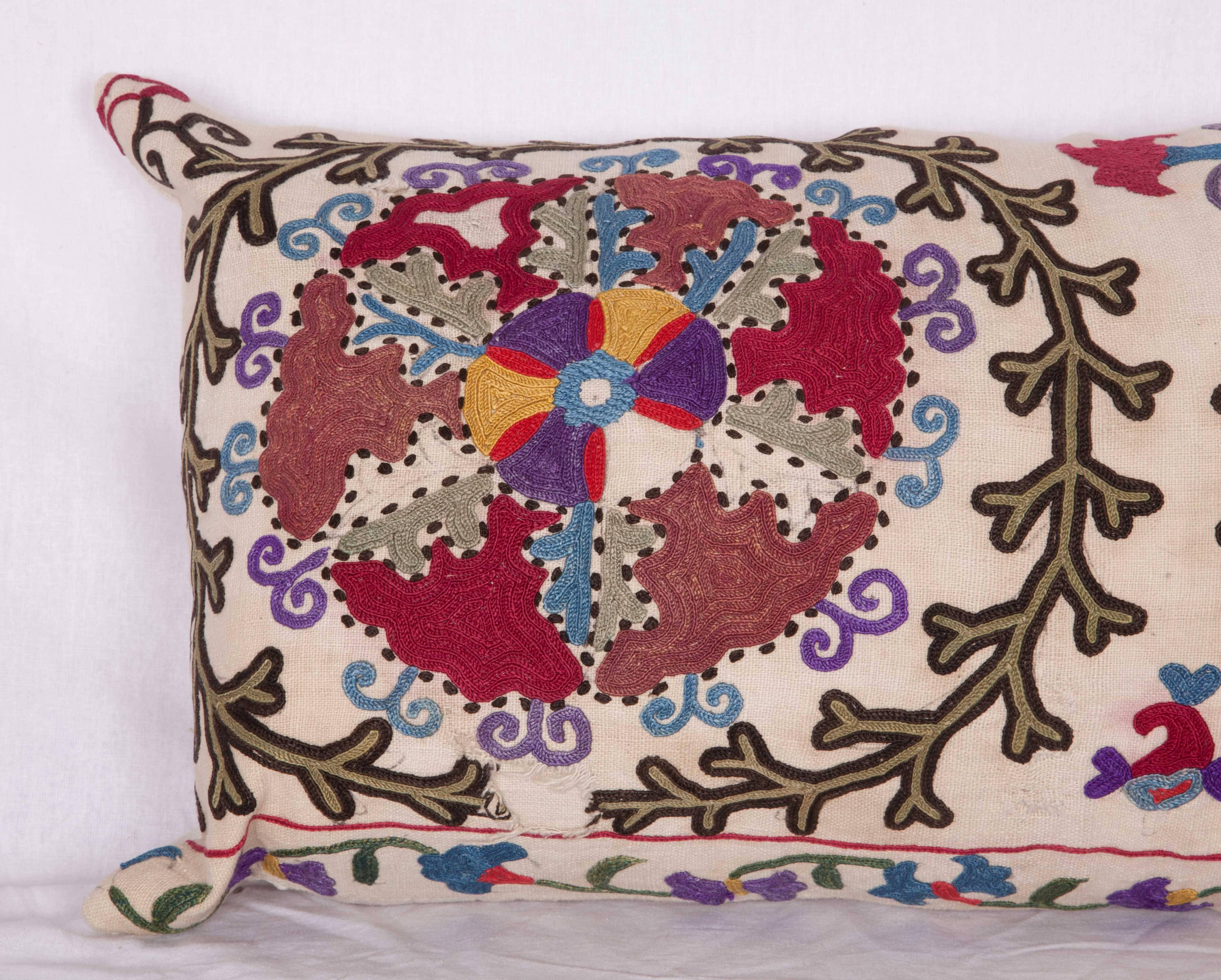 The pillow is made out of a late 19th century, Uzbek Bukhara Suzani. It does not come with an insert but it comes with a bag made to the size and out of cotton to accommodate the filling. The backing is made of linen. Please note 'filling is not