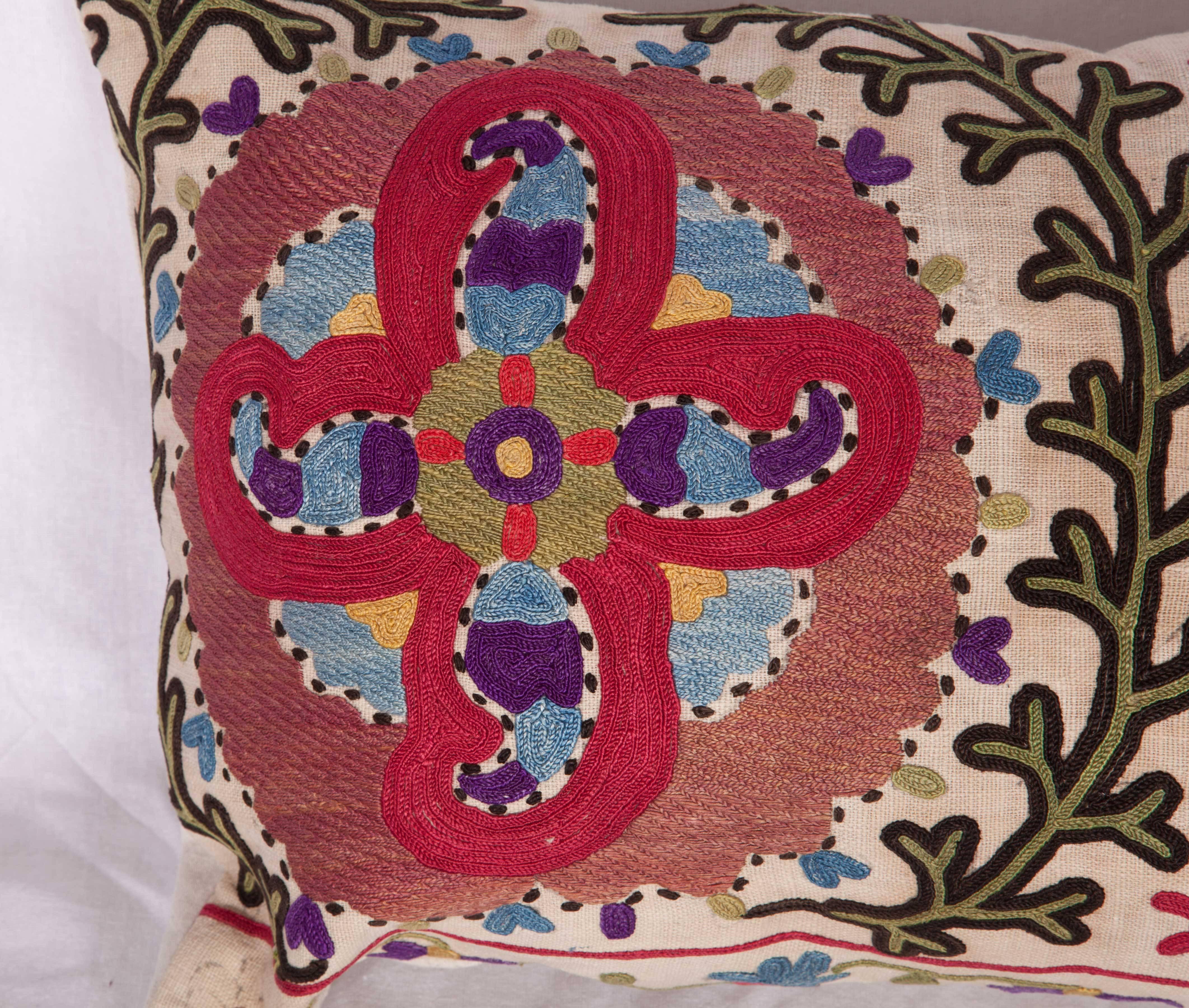 The pillow is made out of a late 19th century, Uzbek Bukhara Suzani. It does not come with an insert but it comes with a bag made to the size and out of cotton to accommodate the filling. The backing is made of linen. Please note 'filling is not