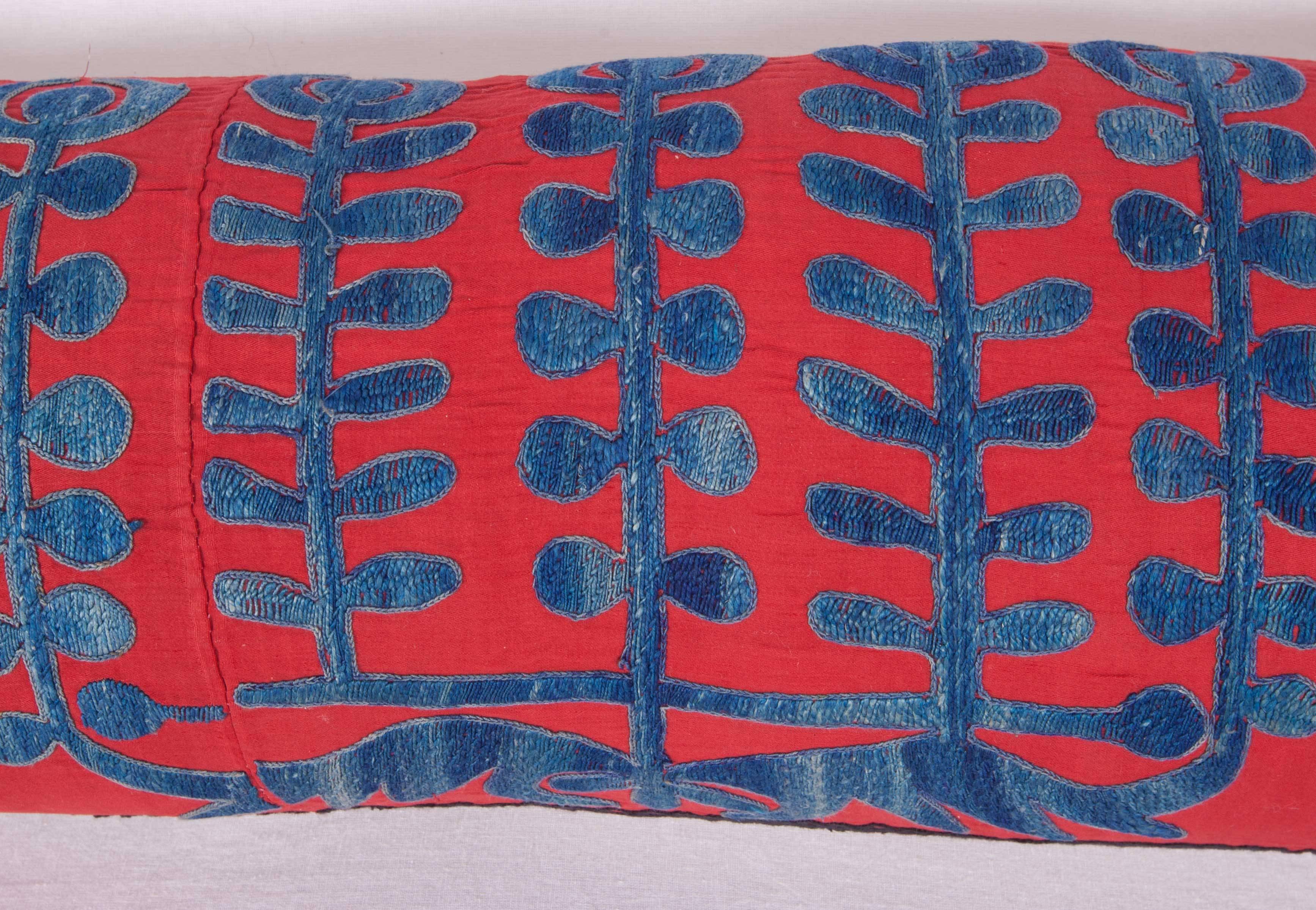 The pillow is made out of a mid-20th century, Uzbek Samarkand silk Suzani fragment. It does not come with an insert but it comes with a bag made to the size and out of cotton to accommodate the filling. The backing is made of linen. Please note