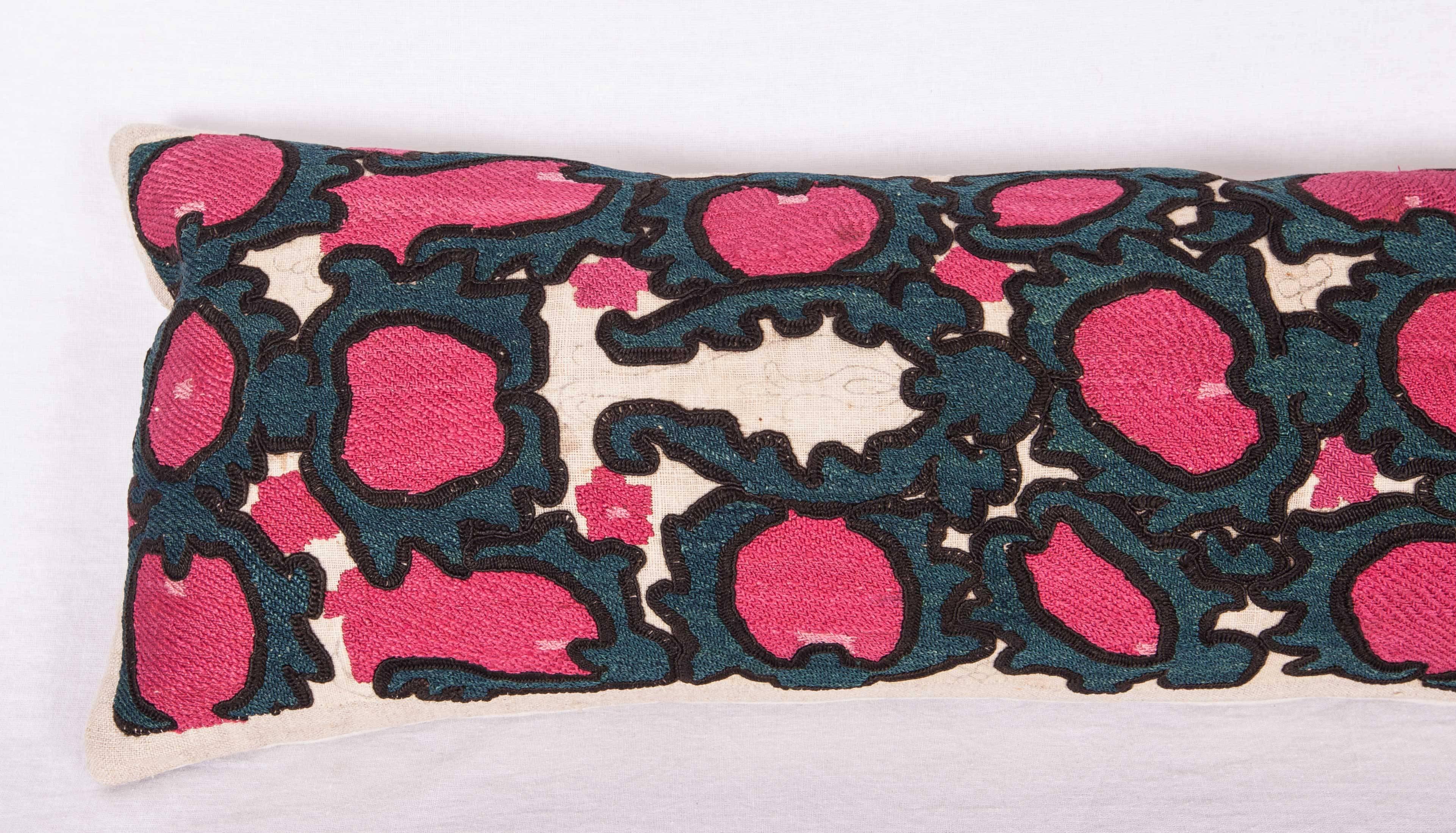 The pillow is made out of a 19th century, Tajik Suzani fragment. It does not come with an insert but it comes with a bag made to the size and out of cotton to accommodate the filling. The backing is made of linen. Please note filling is not