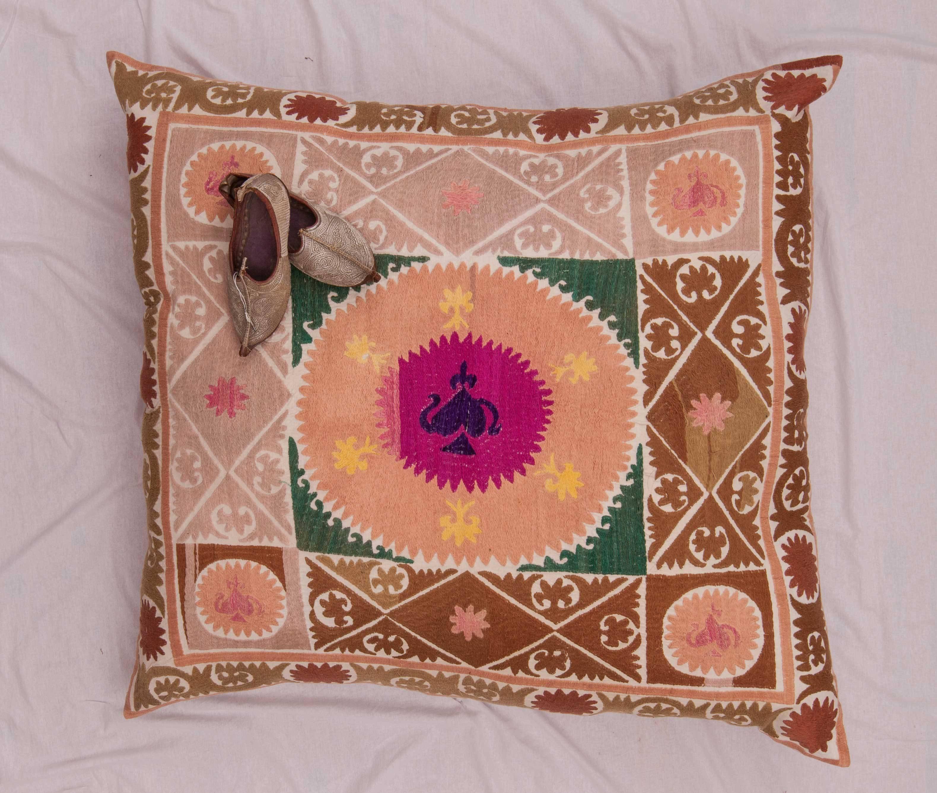 The pillow is made from a mid-20th century, Uzbek Samarkand Suzani. It does not come with an insert but it comes with a bag made to the size and out of cotton to accommodate the filling. The backing is made of pure linen.
Please note: filling is