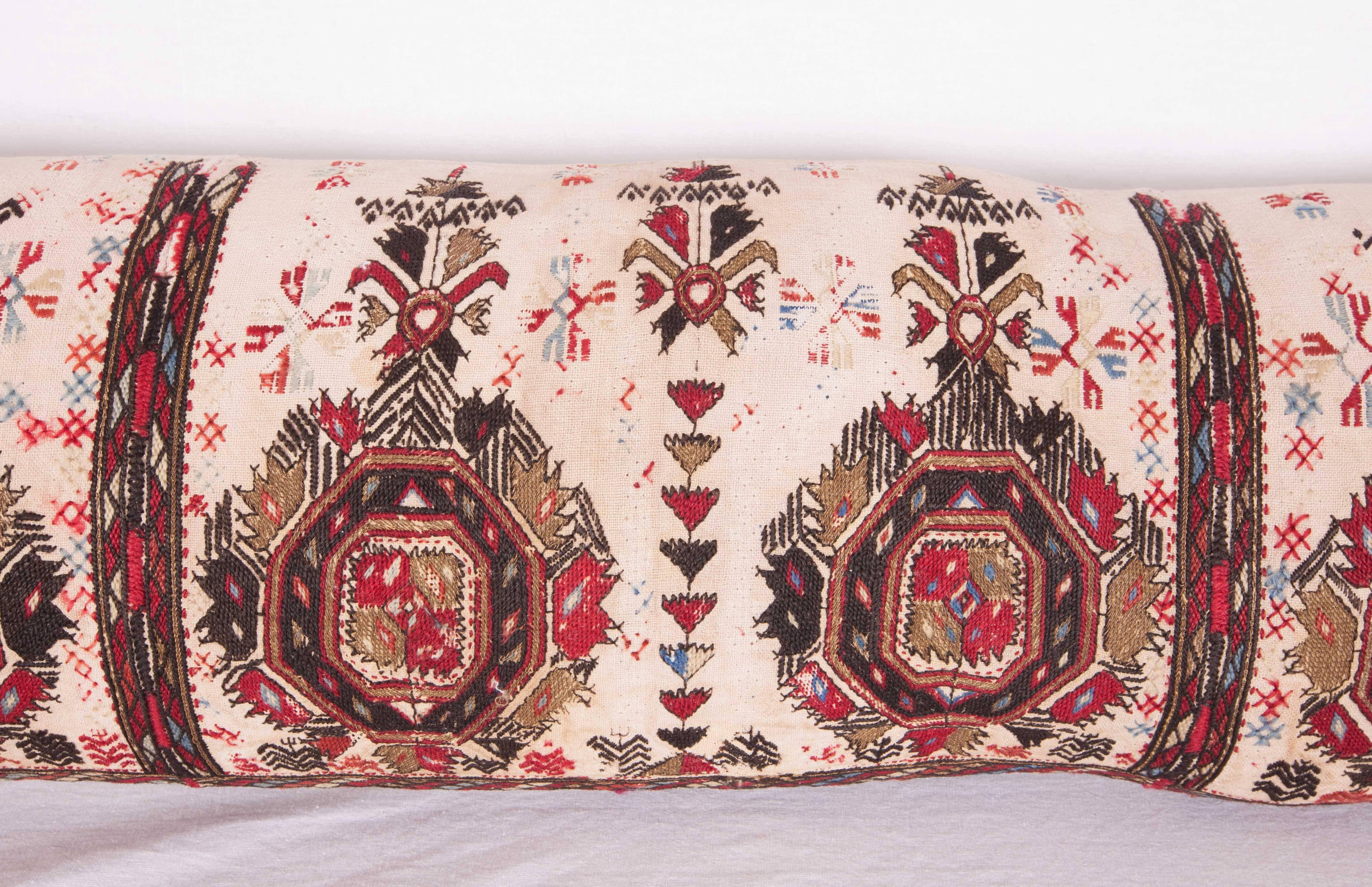 Pillow case is made from an antique 19th century Macedonian Greek embroidery. It does not come with an insert but comes with a bag made to the size and out of cotton to accommodate the filling. The backing is made of linen. Please note filling is