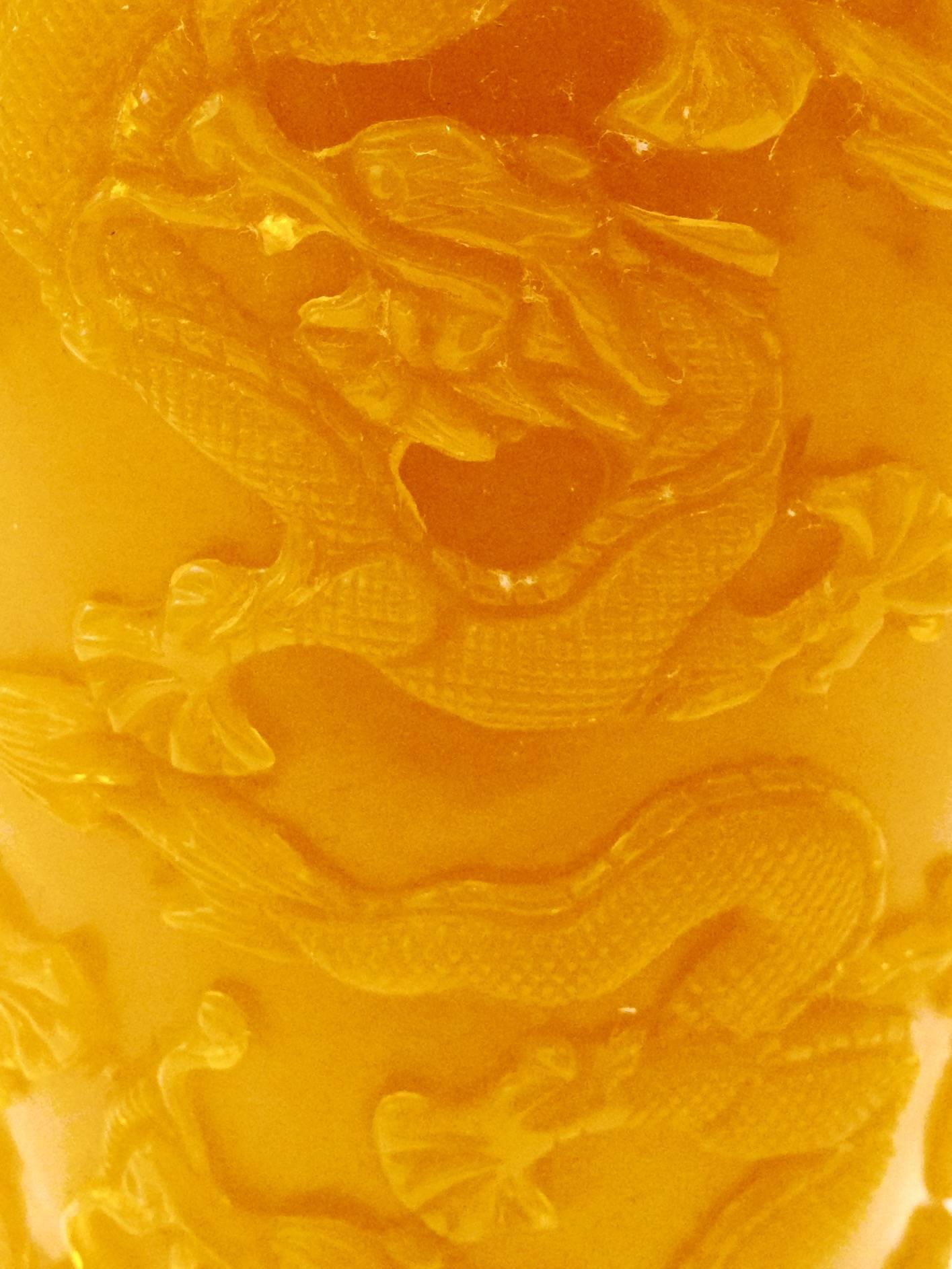 Chinese Imperial yellow carved and textured Peking glass vase. Intricate and detailed carved dragon and phoenix rejoicing motif. Great detail at base and neck. Makers mark appears on the underside.
Please see our listing for a second almost