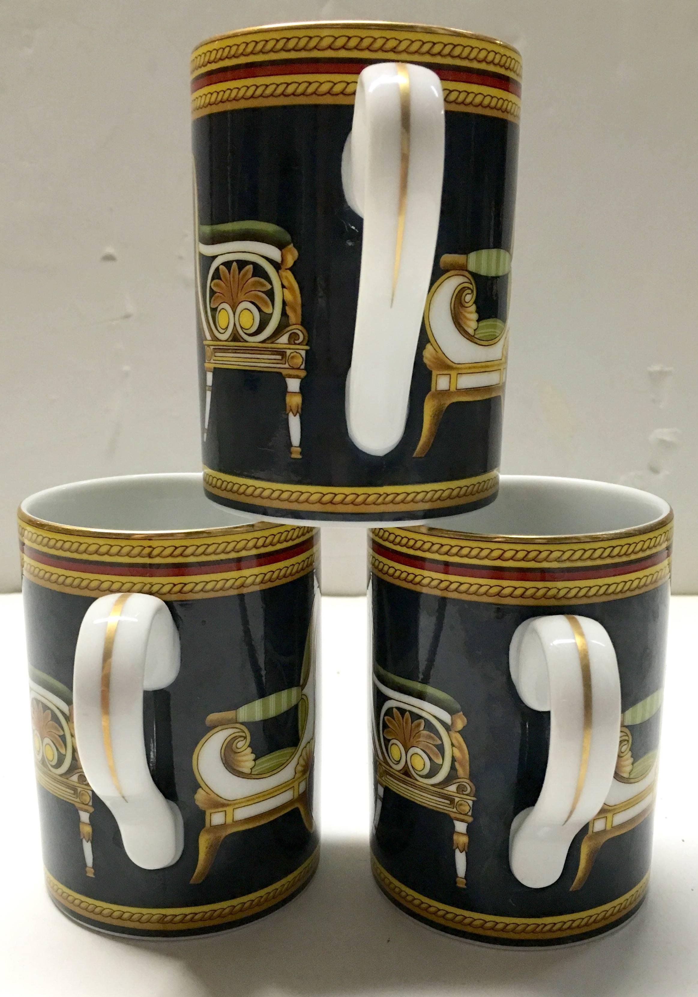 1980s Gucci porcelain handle mugs in navy blue with Italian chair motif. Signed on underside, GUCCI Porcellana.