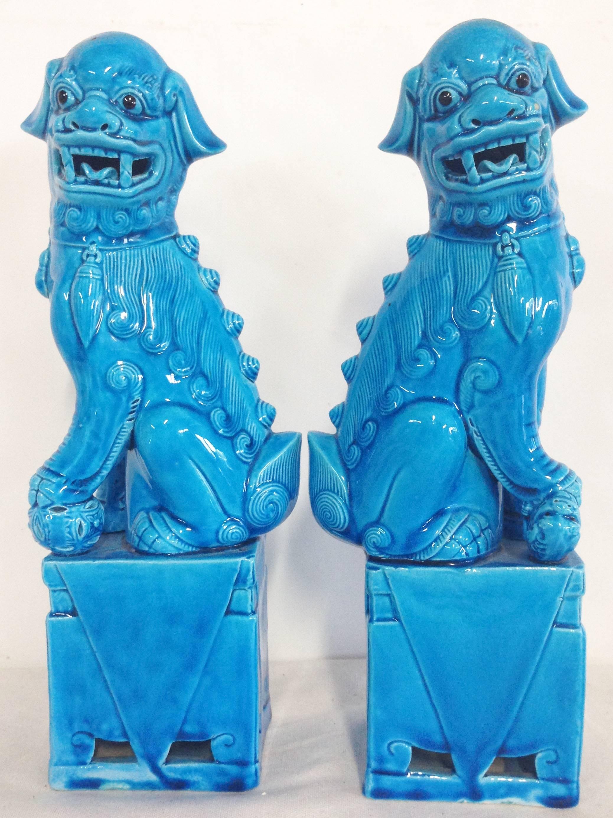 1950s ceramic turquoise Chinese export foo dog pair. Signed imprint on underside, EA3. Amazing detail, black eyes and tall at 12