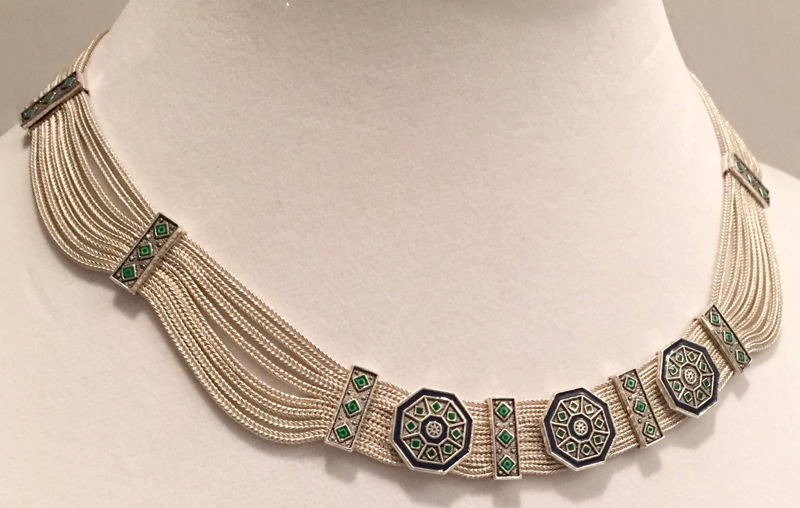 1970s Art Deco style Turkish sterling silver and enamel eight strand silver chain detail demi parure. This stunning necklace and bracelet set is adorned with enamel mosaic work in kelly green and navy blue. Each piece is signed 925 and in illegible