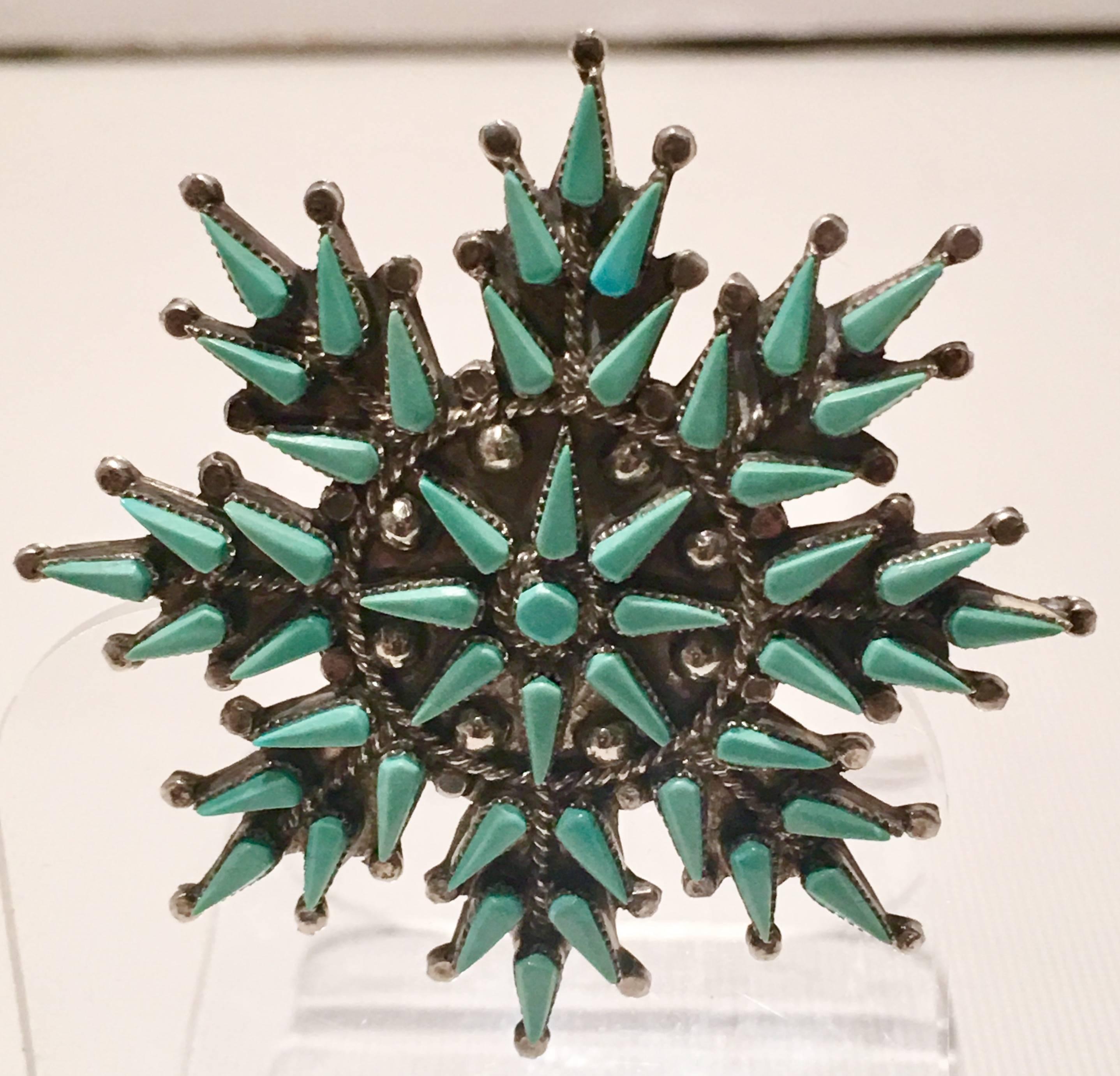 1940s sterling silver and turquoise needlepoint snow flake brooch signed by the artist, This handmade piece is signed on the underside, Vera Halusewa Zuni.
  
