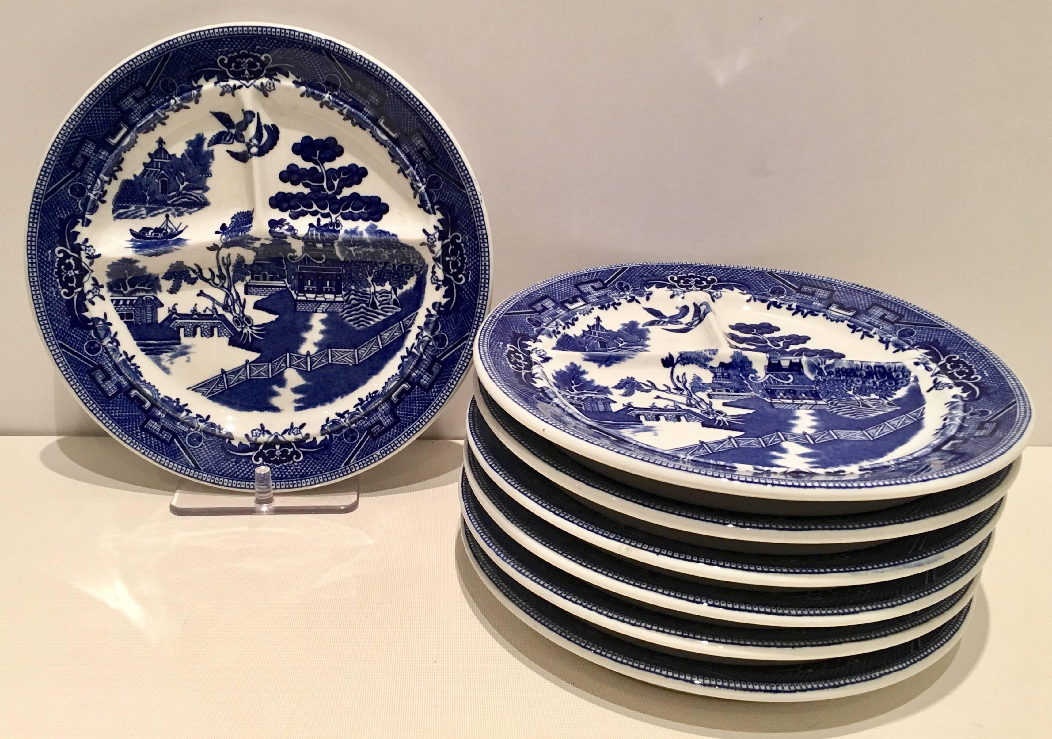 Vintage set of seven ceramic divided grill dinner plates by Shenago. Only one piece is signed on the underside, Shenago China New Castle.
The Willow pattern features a large Pagoda style home with a large willow tree with two love birds as the