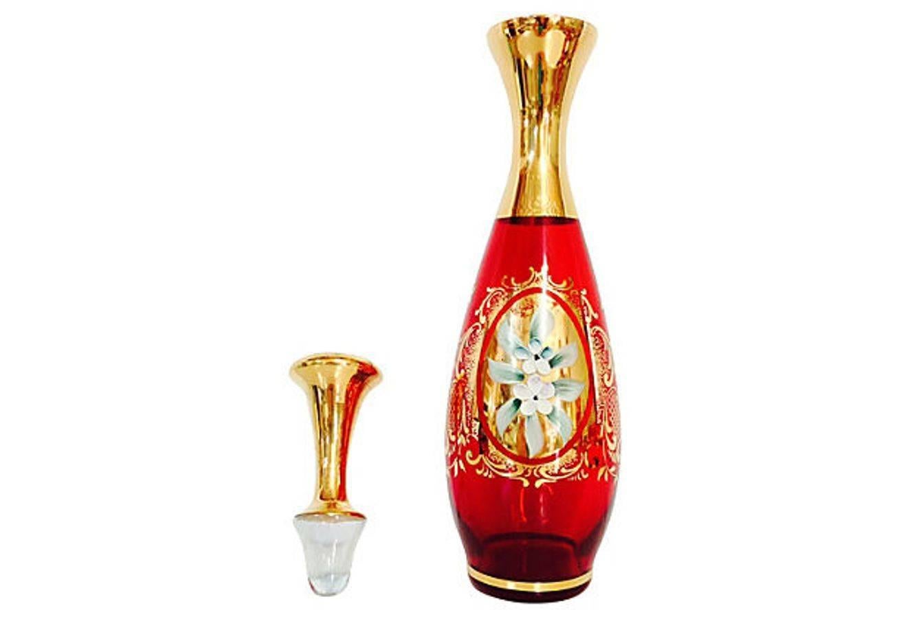 Mid-Century set of eight hand-painted floral motif Italian Venetian glass ruby and 18-karat gold detail decanter and glasses. Glasses measure, 2.5" H x 1/75" diameter.