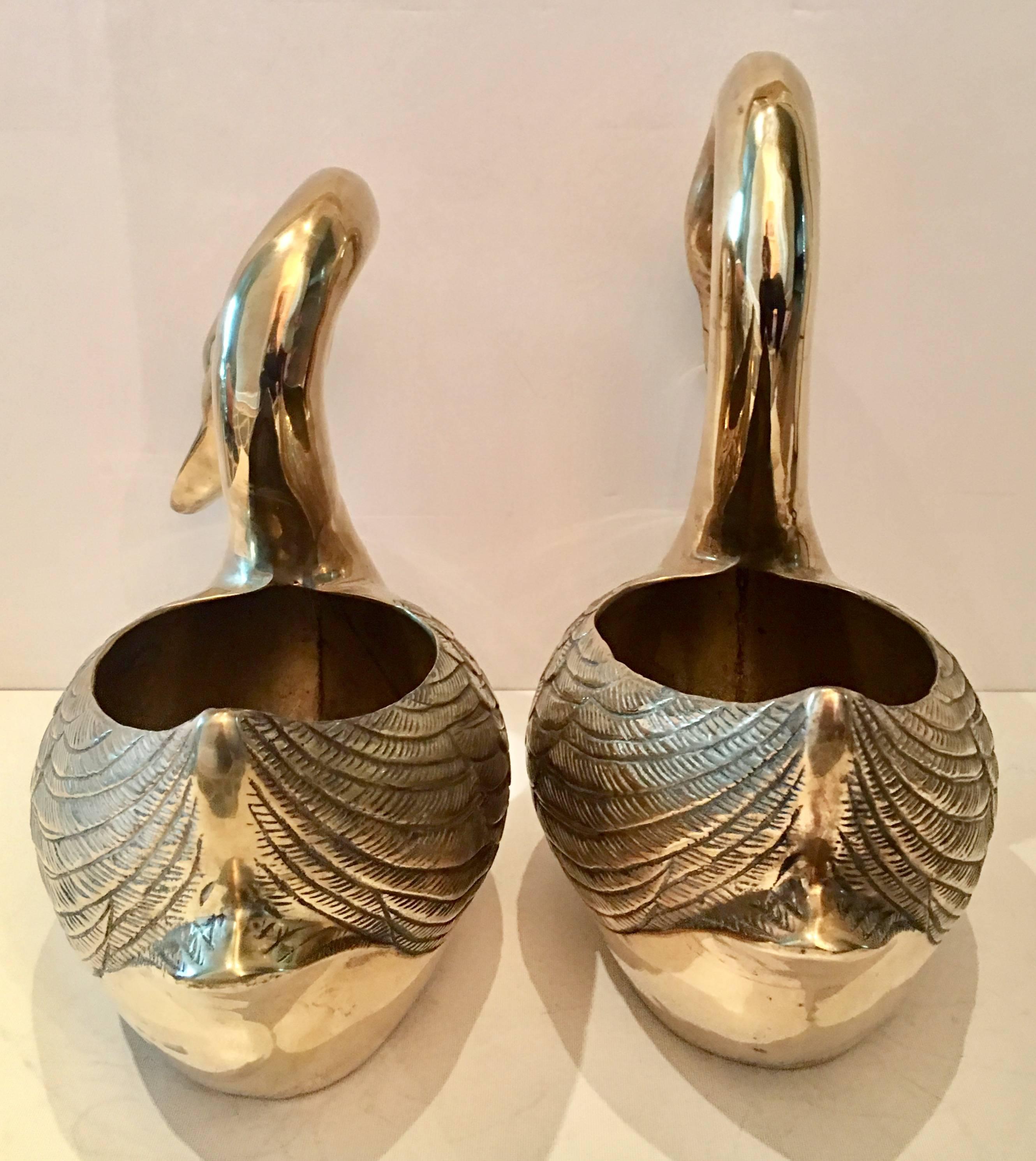 large brass swans