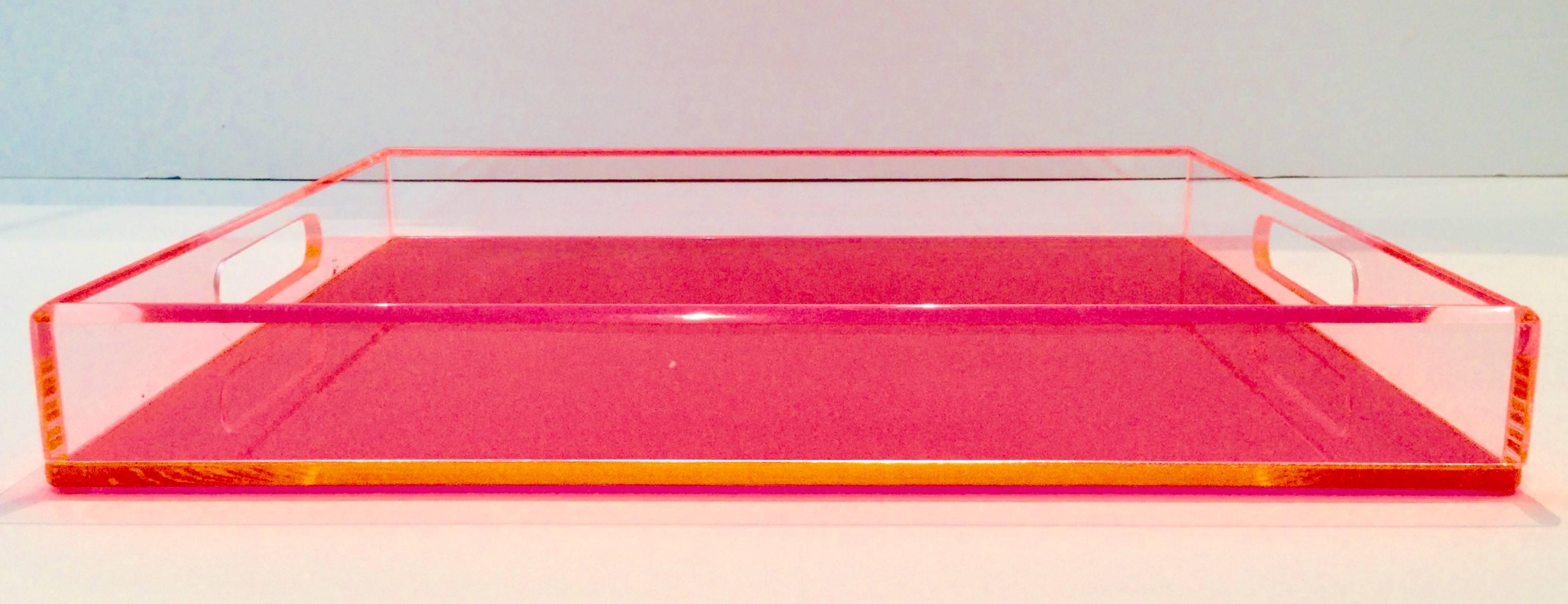 21st Century custom fabricated in Palm Beach By, JMD Boutique, neon pink and clear cut-out handle Lucite tray. The sides are made of clear Lucite and the bottom piece is neon pink with orange light effect trim. Features beveled edges and four clear