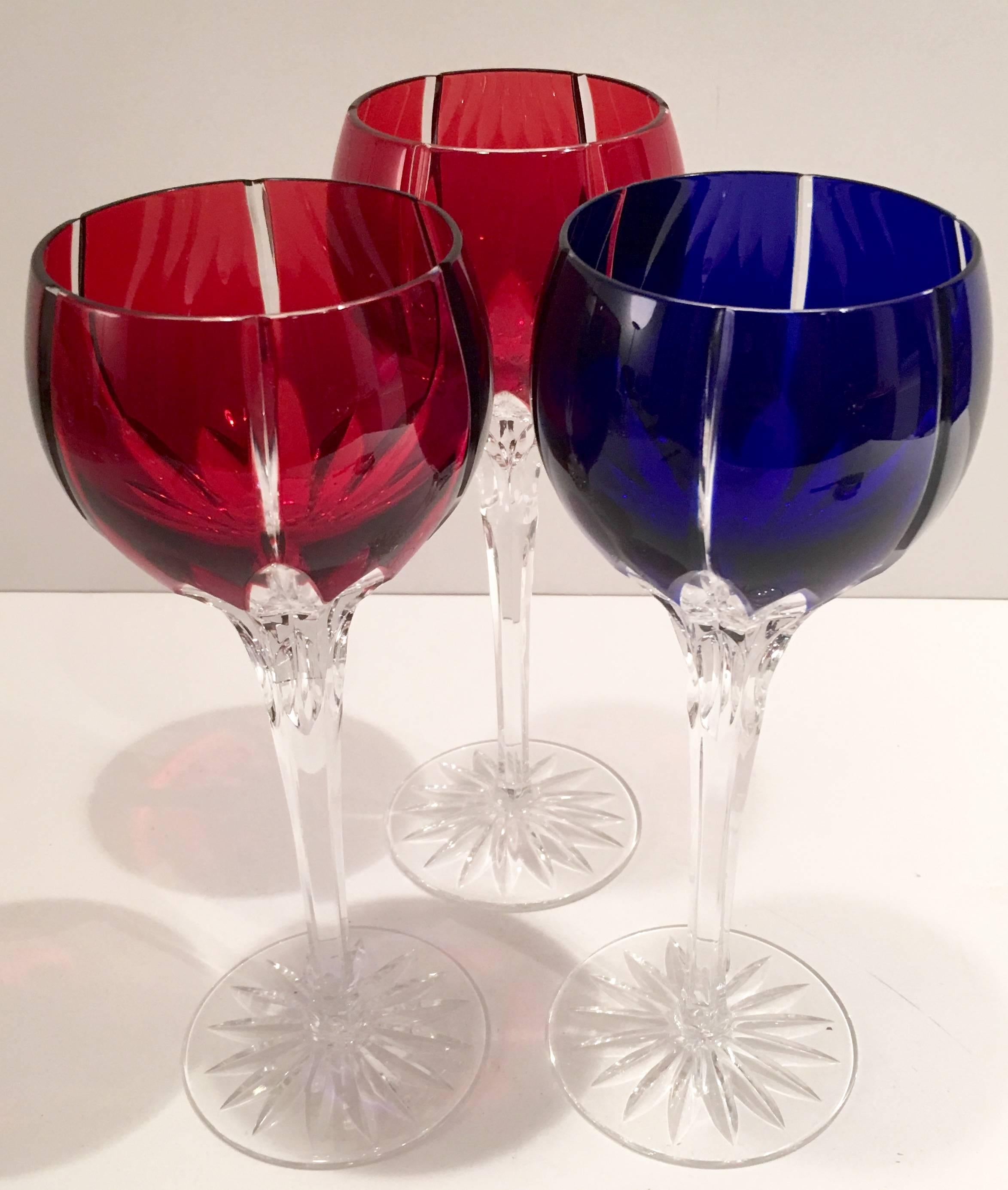 Classic set of three bohemia cut to clear crystal stem glasses. Set includes two ruby and one cobalt colored glass.