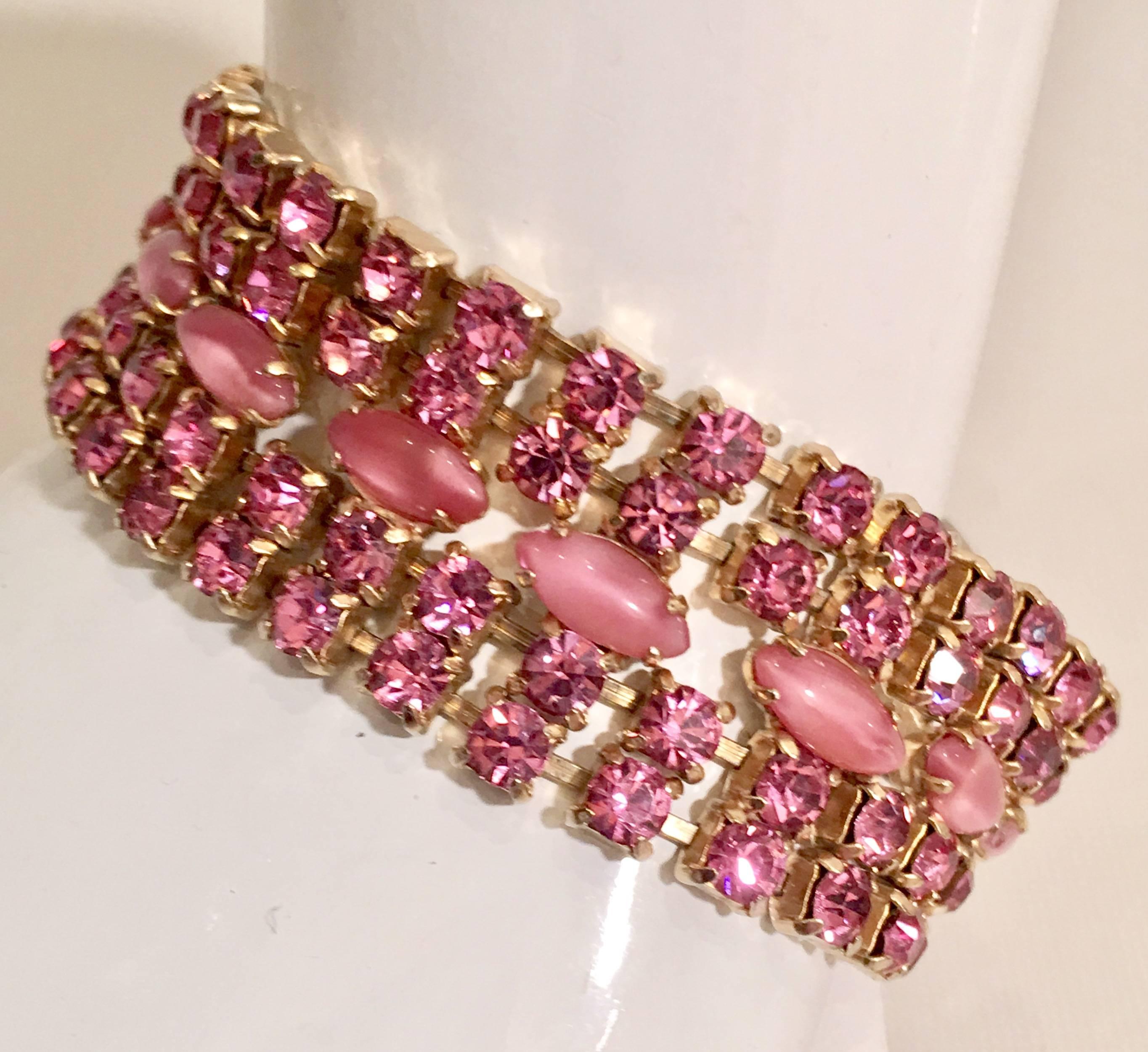 1970s vibrant pink crystal and pink oval opal rhinestones set in gold plate metal. This stunner is an unmarked piece.