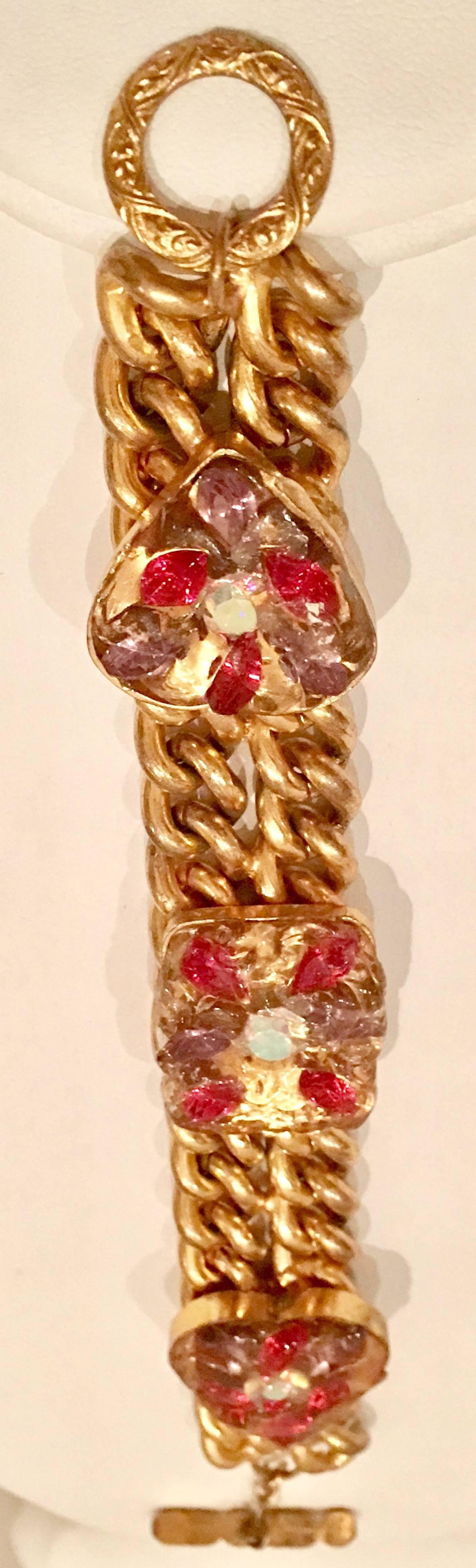 Molded glass encased Austrian crystal rhinestone gold plate double chain link bracelet. Features two hearts and one square form multicolored crystal rhinestones under molded glass. Each ornament measures approximately, 1