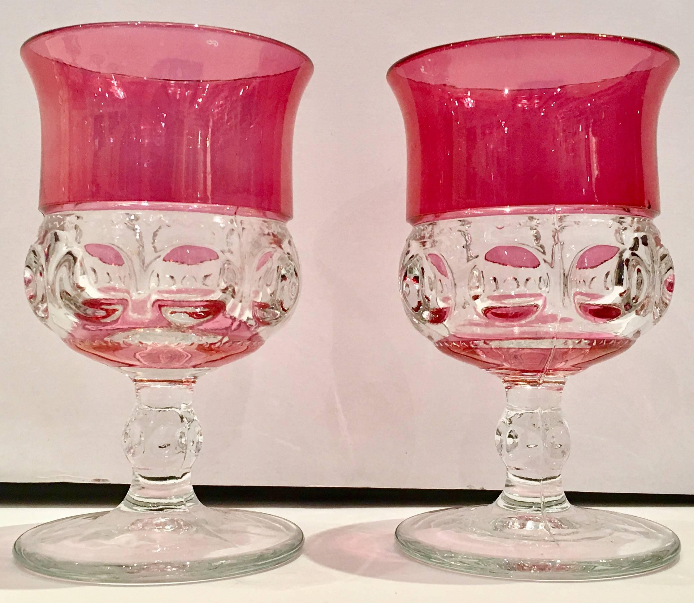 1960s set of six American ruby-pink iridescent cut crystal thumbprint stem glasses. These Classic American collectible glass was manufactured by, The Tiffan Glass Co. cut to clear 