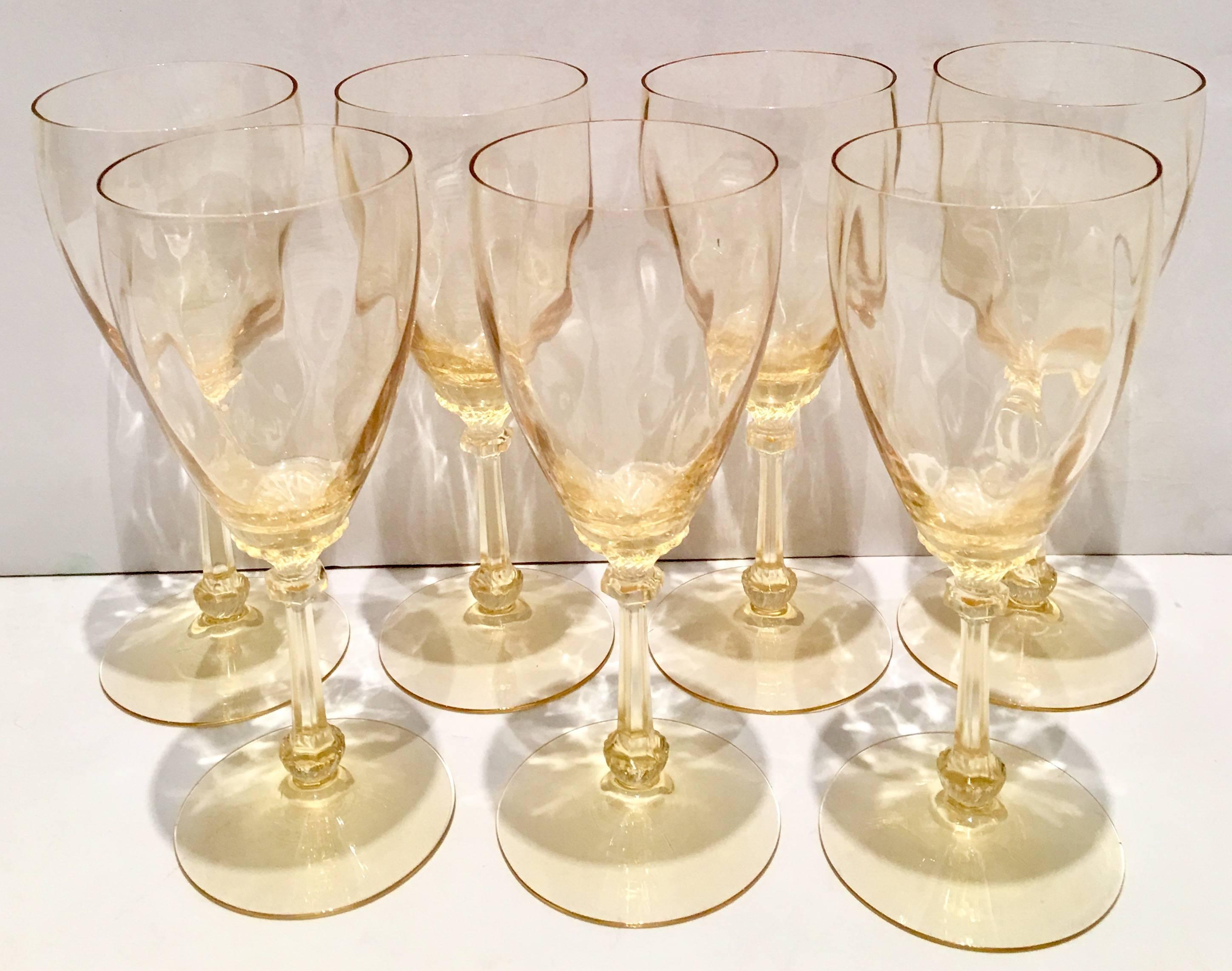 Mid-20th century yellow depression glass set of seven stem glasses. Pattern features a optic bowl and cut stem.