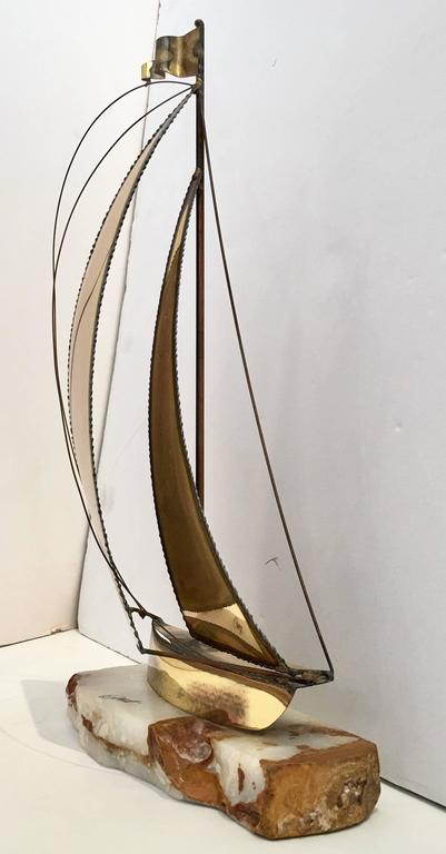 brass sailboat sculpture