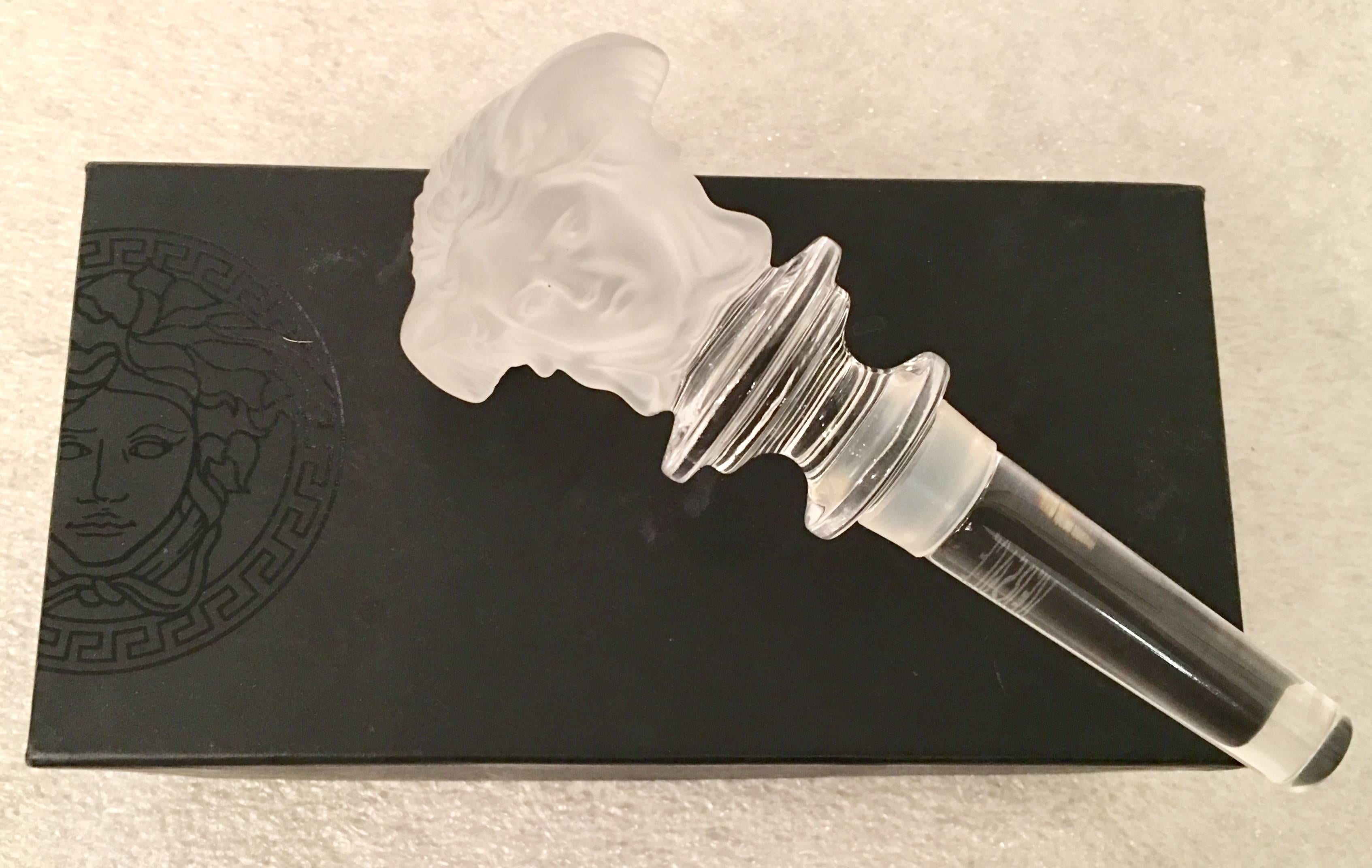 Crystal clear and frosted medusa head bottle stopper by Rosenthal for Versace.
Includes original Versace protective gift box. This piece is signed on the clear stem.
