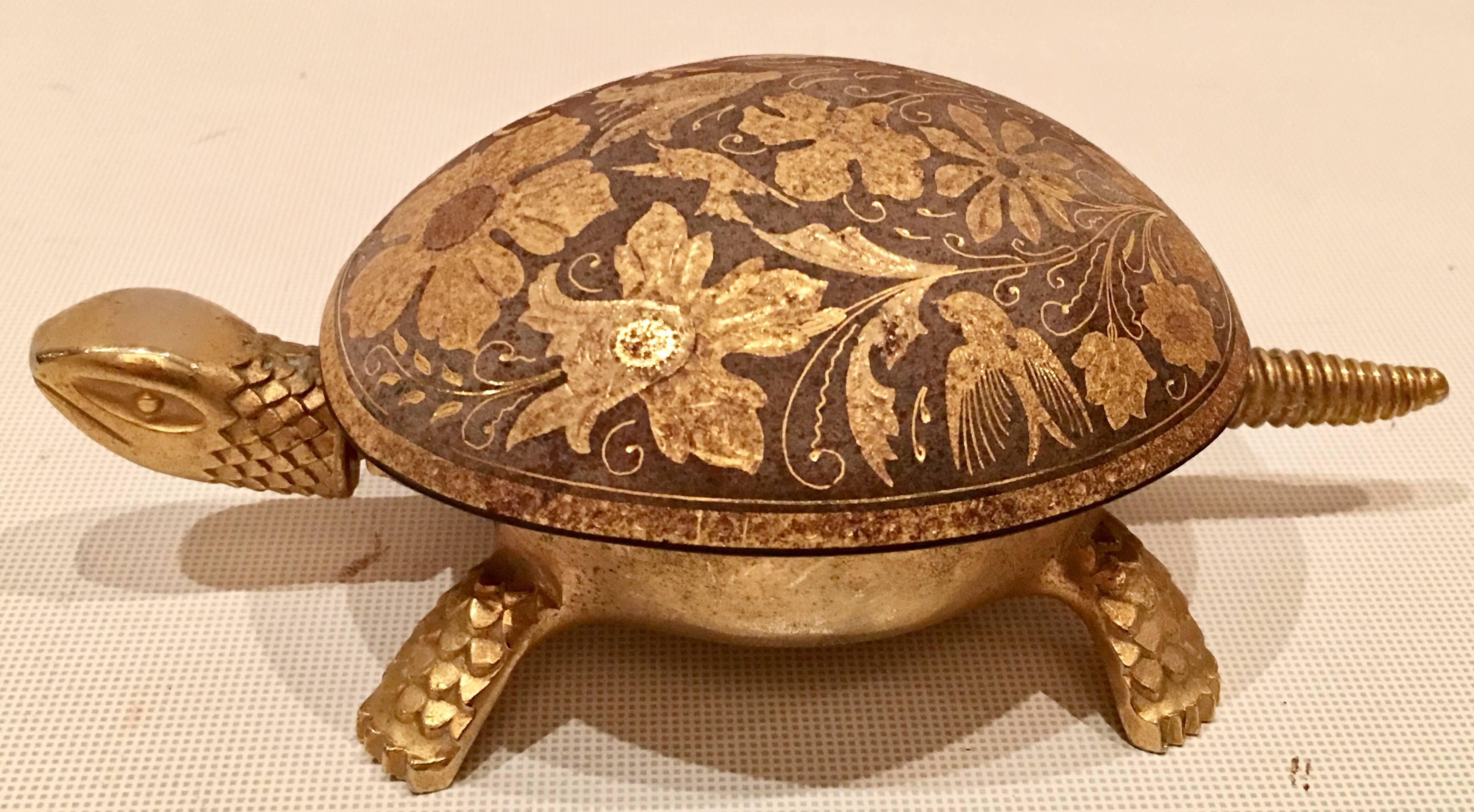 Mid-Century brass turtle hotel bell by, Boj Eiber, made in Spain. Both the head and tail can be depressed to operate. This turtle is in full working order. Features a floral motif on the turtle shell. Signed on the underside.