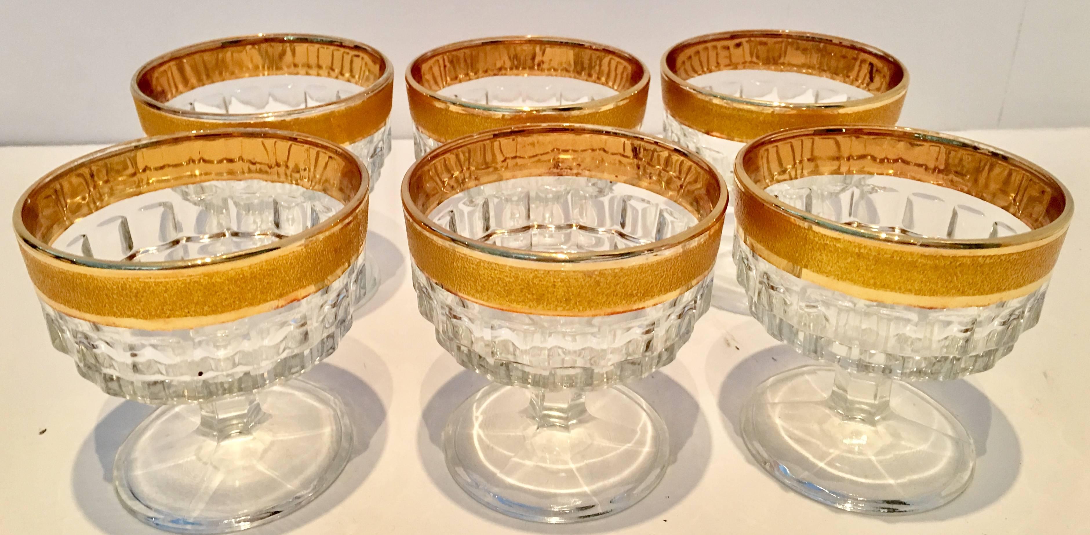 Italian cut crystal coupe drinking glass. Features a frosted 22 karat "gold sugar" rim.
 