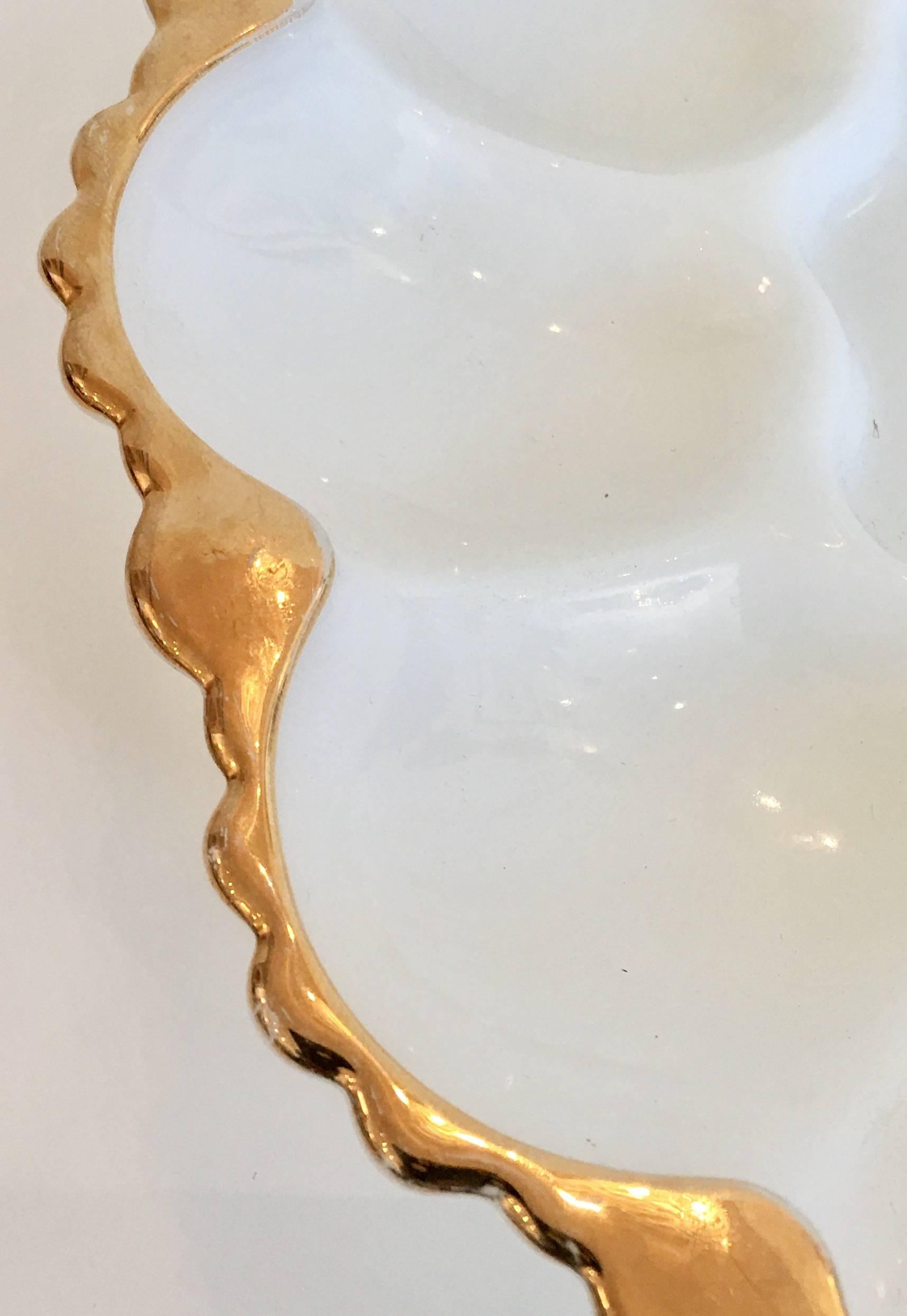 Vintage American milk glass with 22 karat gold trim detail deviled egg serving platter. Gorgeous cut detail on the underside.