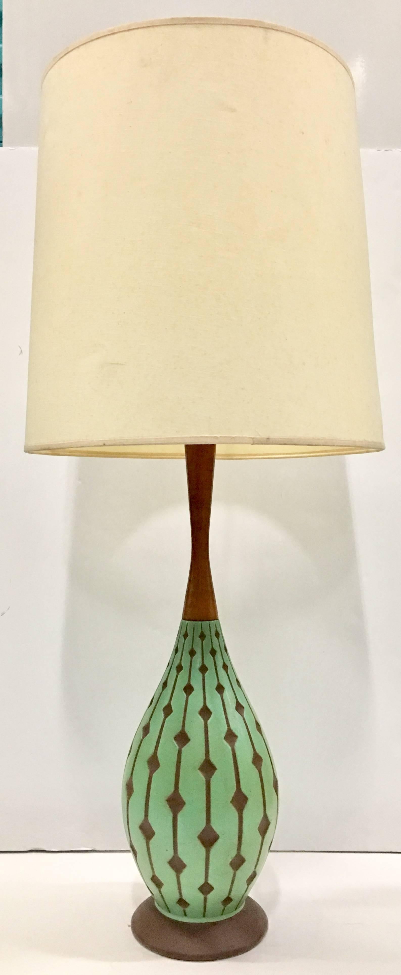 Incredible and unique these quintessential Mid-Century Modern "Bowling Pin" shape hand-painted inverted diamond pattern lamps are made entirely of ceramic until you reach the neck. The neck is made of walnut. The bases are made entirely of