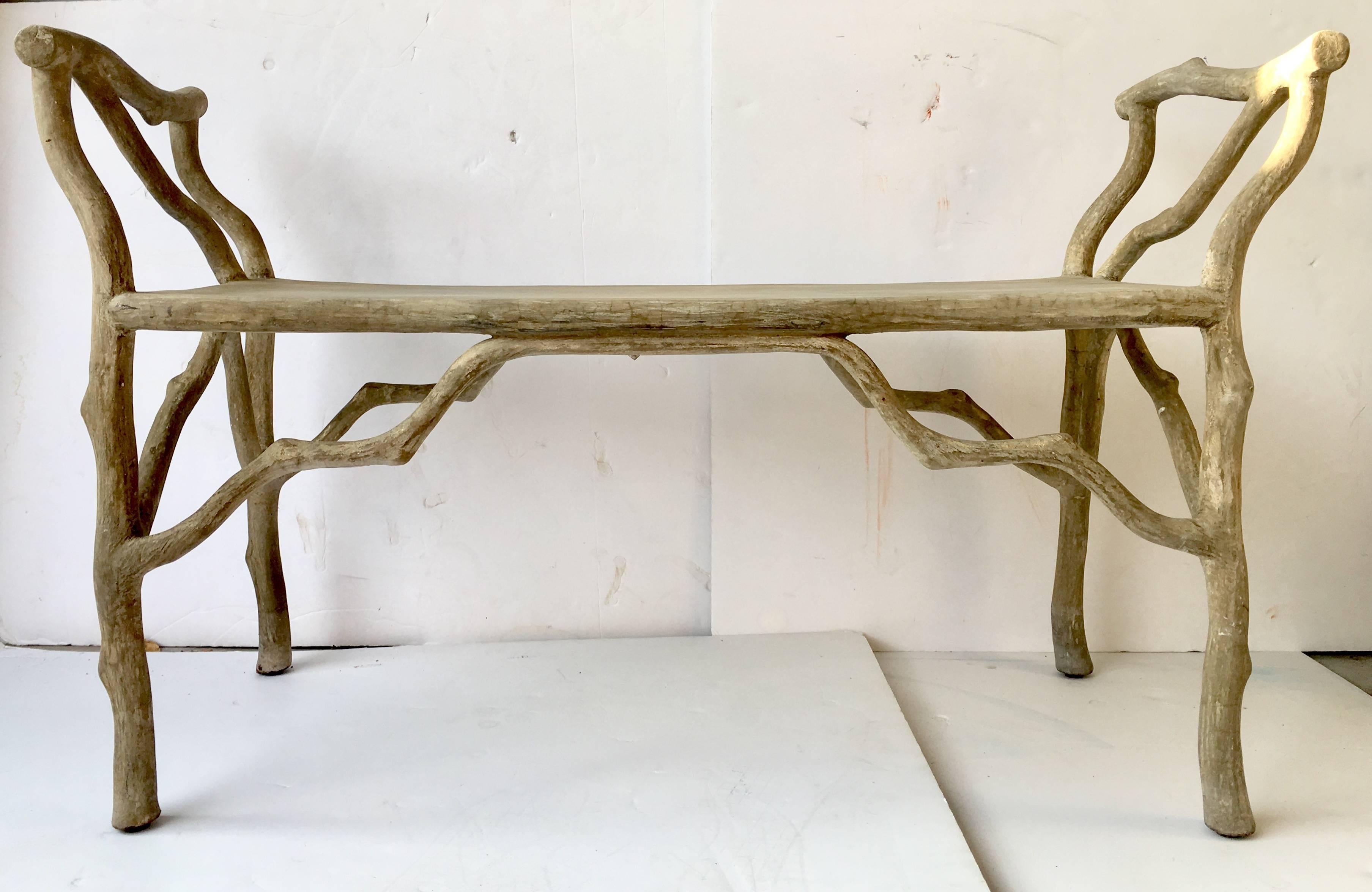 Contemporary organic form faux bois metal based concrete bench.