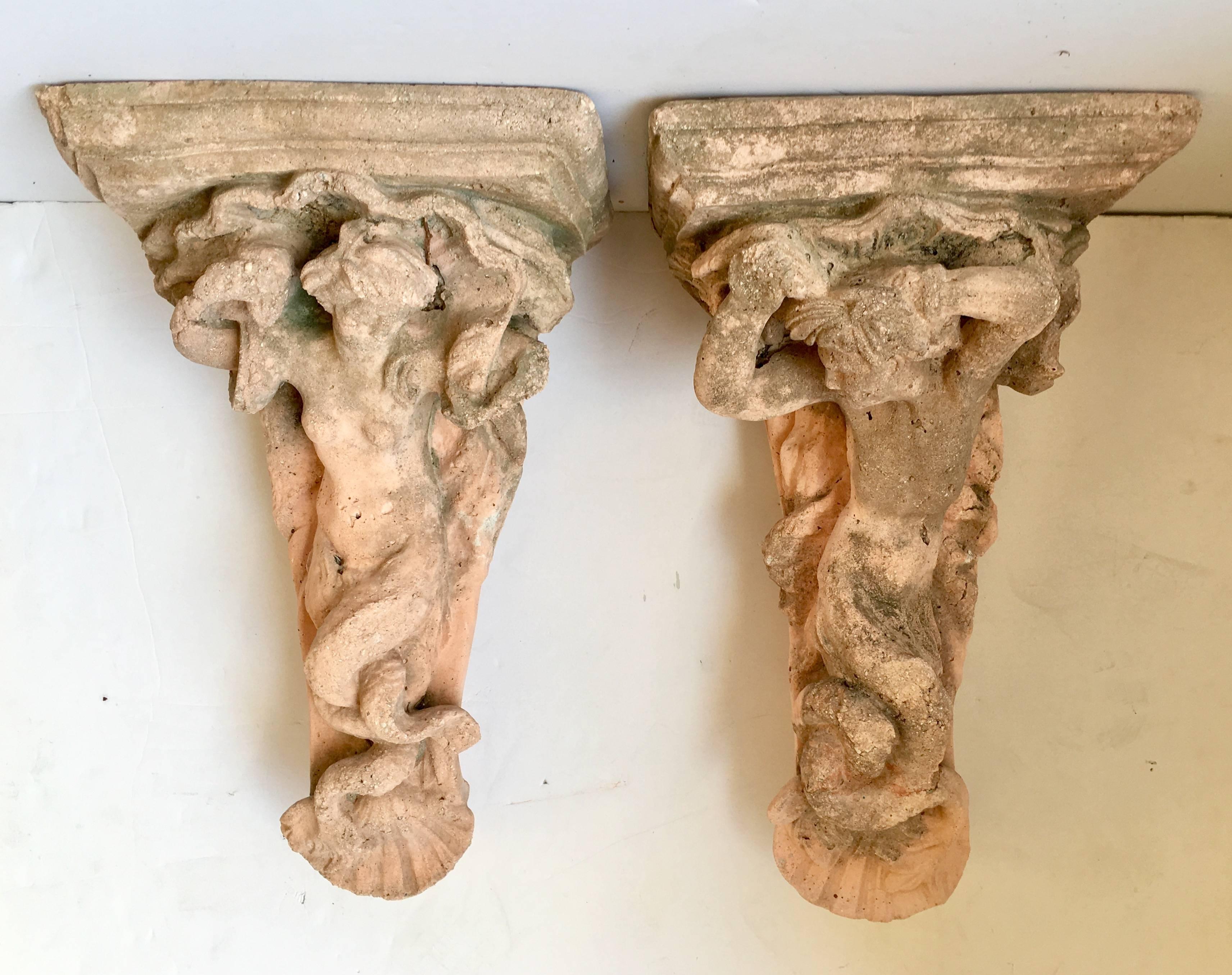 Incredible God & Goddess cast stone patina intricate corbel wall brackets. These vintage brackets as they are have a coveted and aged patina. They could be cleaned for a newer look. Pre - installed steel hooks are installed on the back side of