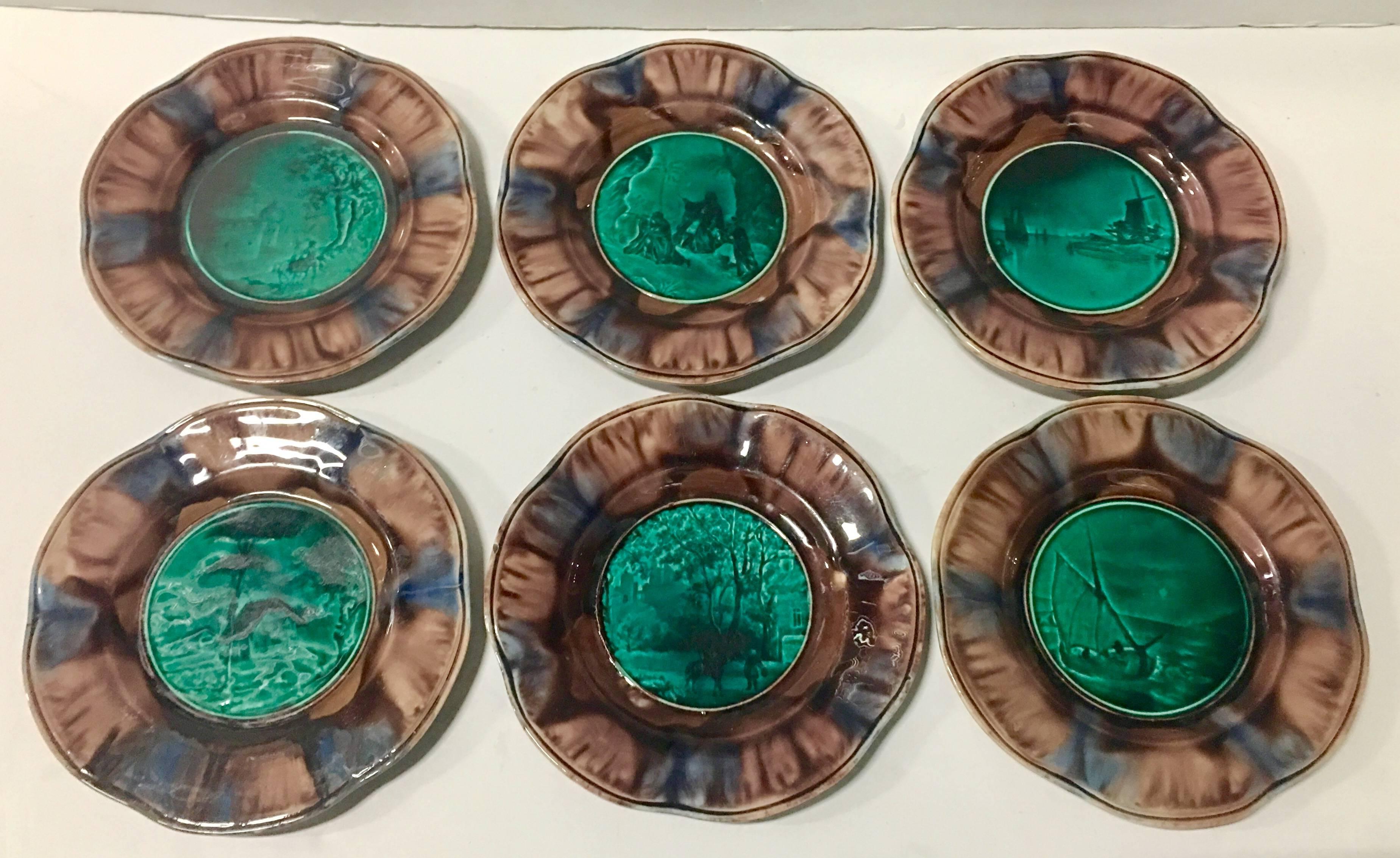 Rare circa 1840s French Rubelles Majolica collector plates, set of six. Set includes six plates, all with a different central motif, landscape and home, three wise men, sail boat, boat, nomad, man on horse with arabesque style home in background and