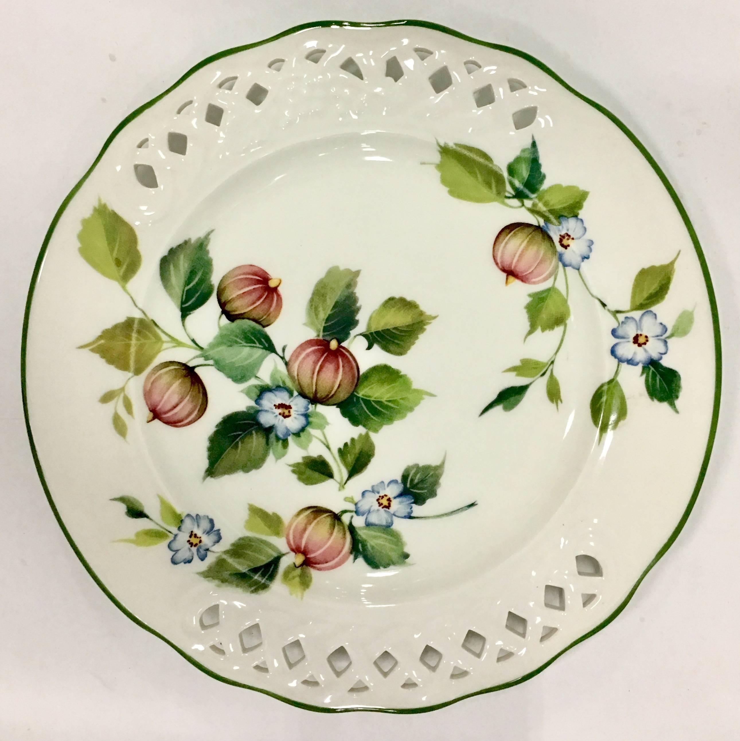 Vintage set of twelve pieces ceramic pierced edge dinnerware set in the "Tiffany" pattern by, Brunelli. Set includes, seven salad/dessert plates, four dinner plates and one round chop platter. Signed on the underside, Designed by Brunelli,