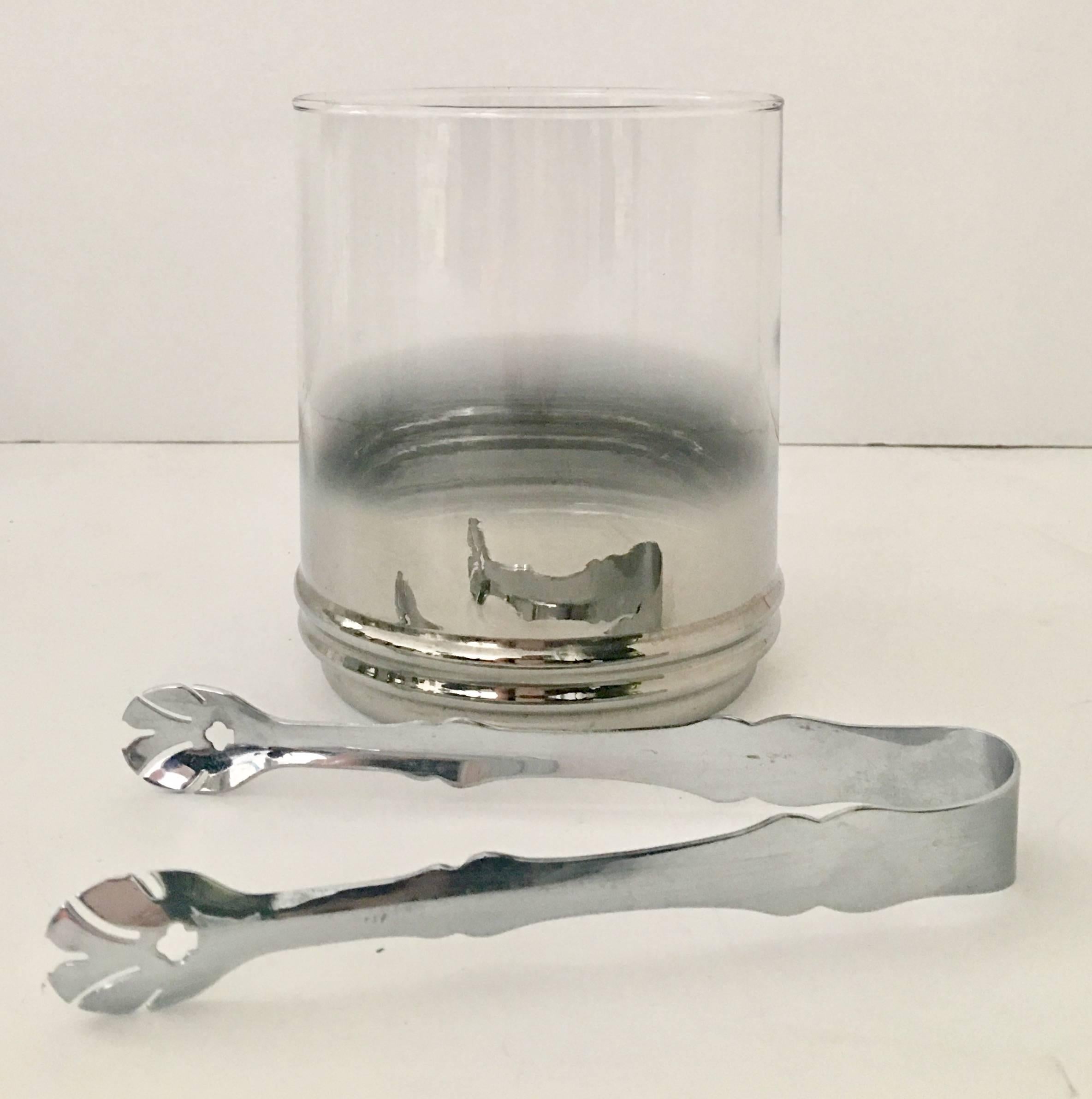 Mid-Century Modern Dorothy Thorpe designed sterling silver overlay "Fade Out" glass drinks set, twenty one pieces.
Set includes,
eight stem goblet glasses, 6" H x 2.75" D.
eight high ball glasses, 5.5" H x 2.75"