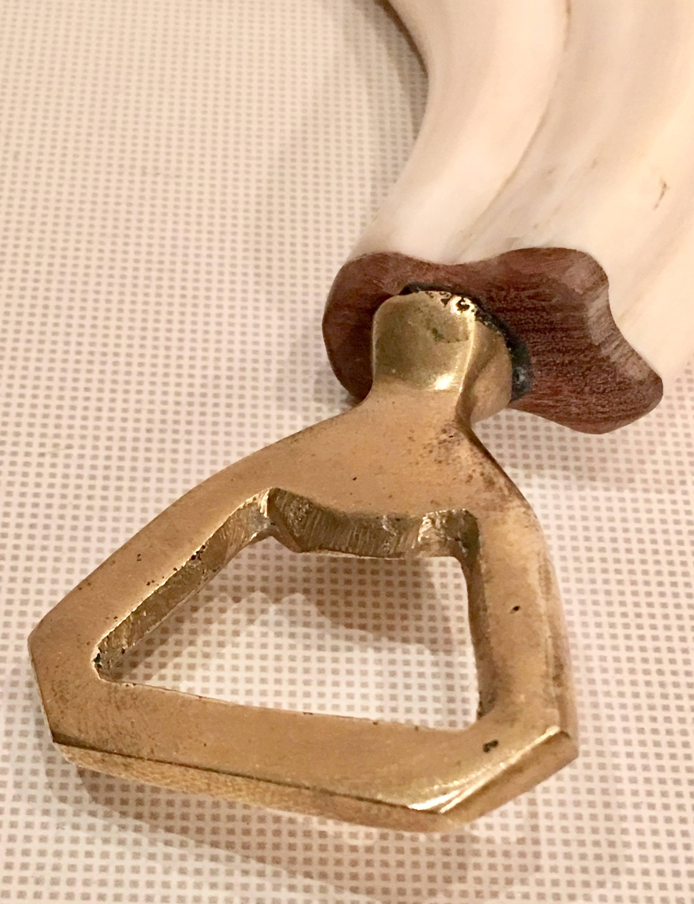 Antique Scrimshaw Style Carved Bone and Brass Bottle Openeer 1