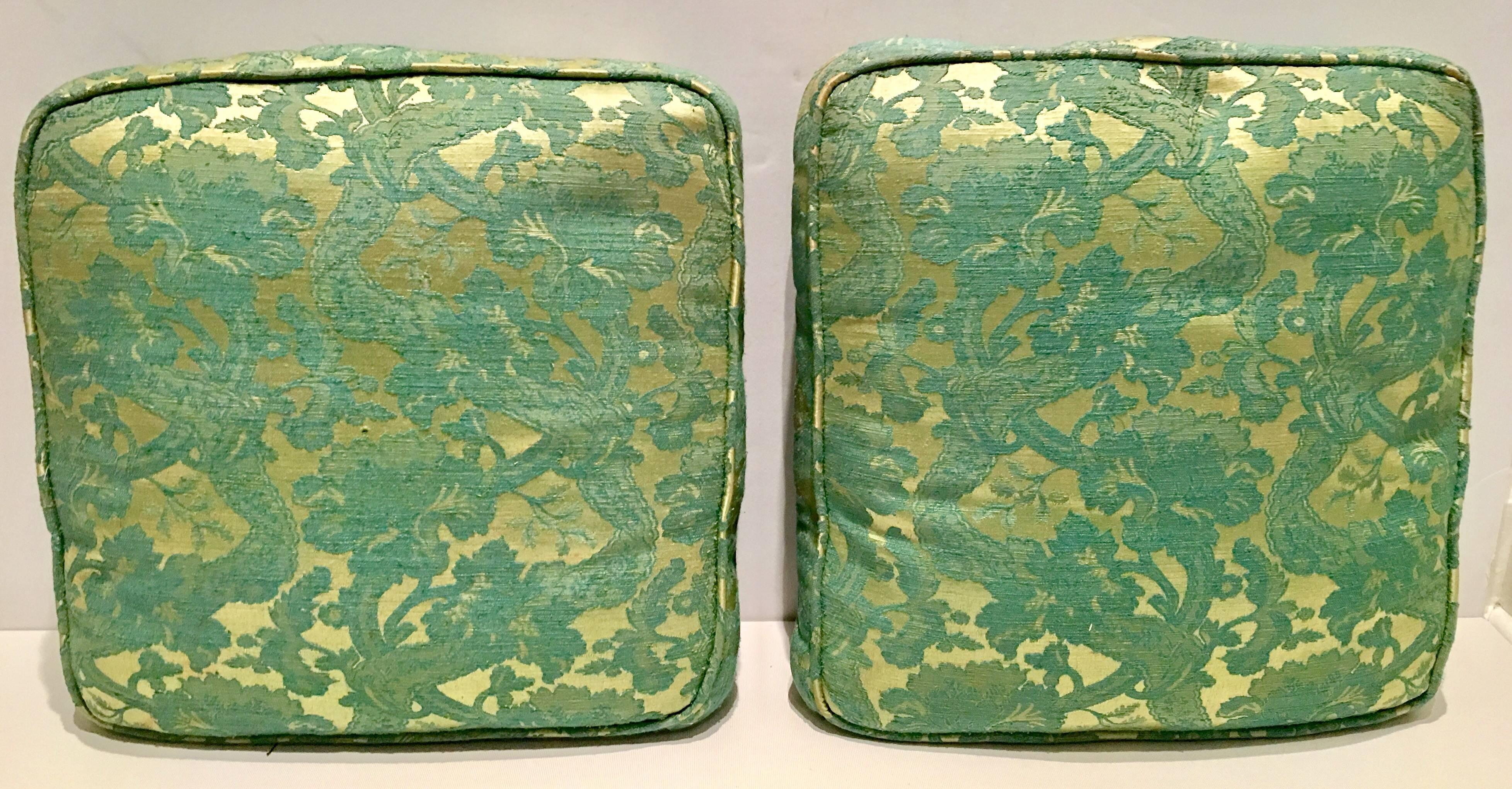 From a French Estate, A Pair of 19th Century chartreuse and turquoise damask lace over metallic silk square pillows or seat cushions with a self welt. The original linen covered part down inserts are present and in amazing pristine condition. Zipper