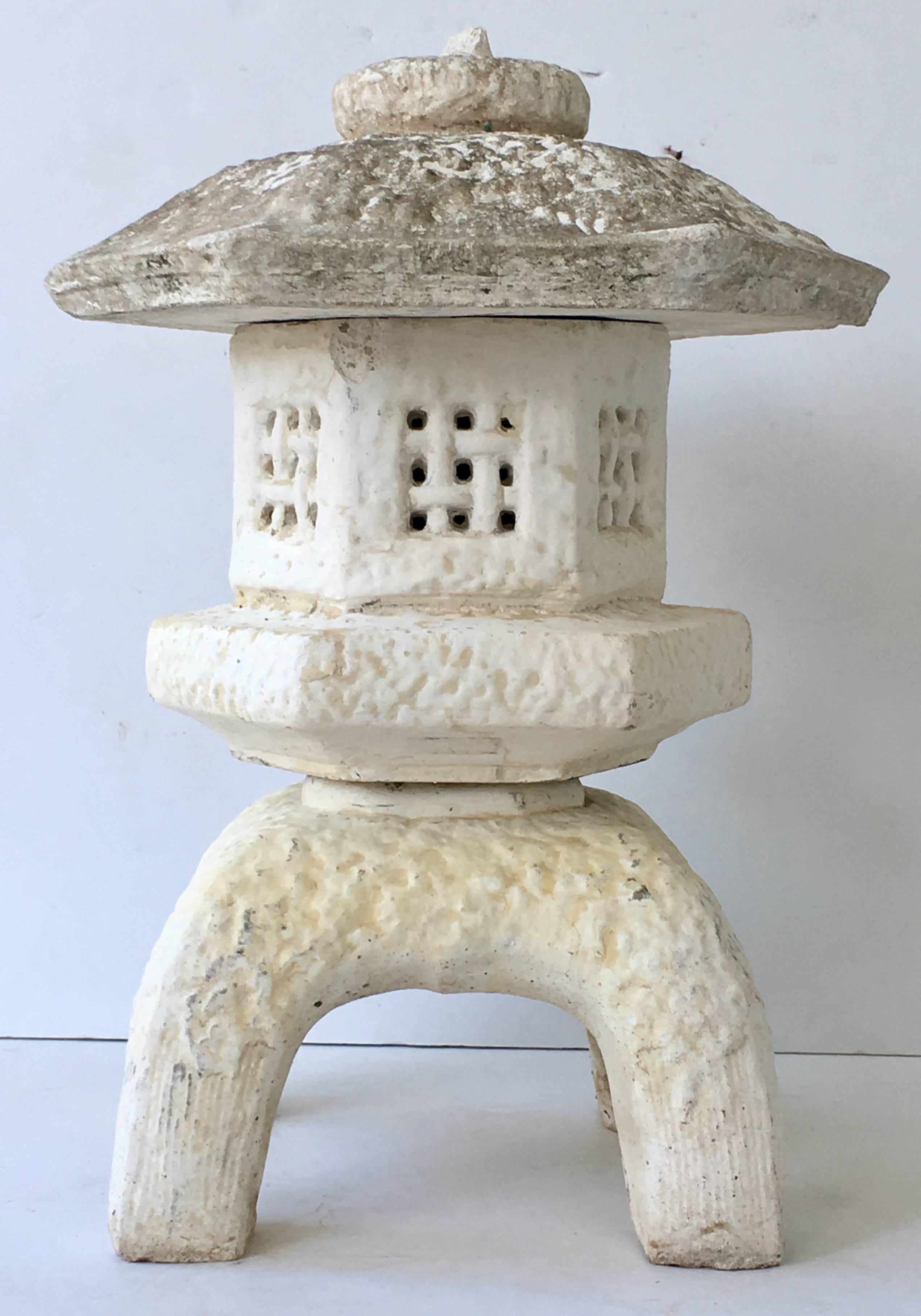 Mid-Century Japanese three-piece cast stone pagoda lantern sculpture.
This coveted patina aged garden sculpture is three pieces, the base, the body and lid. Appropriate wear and patina for age and use.