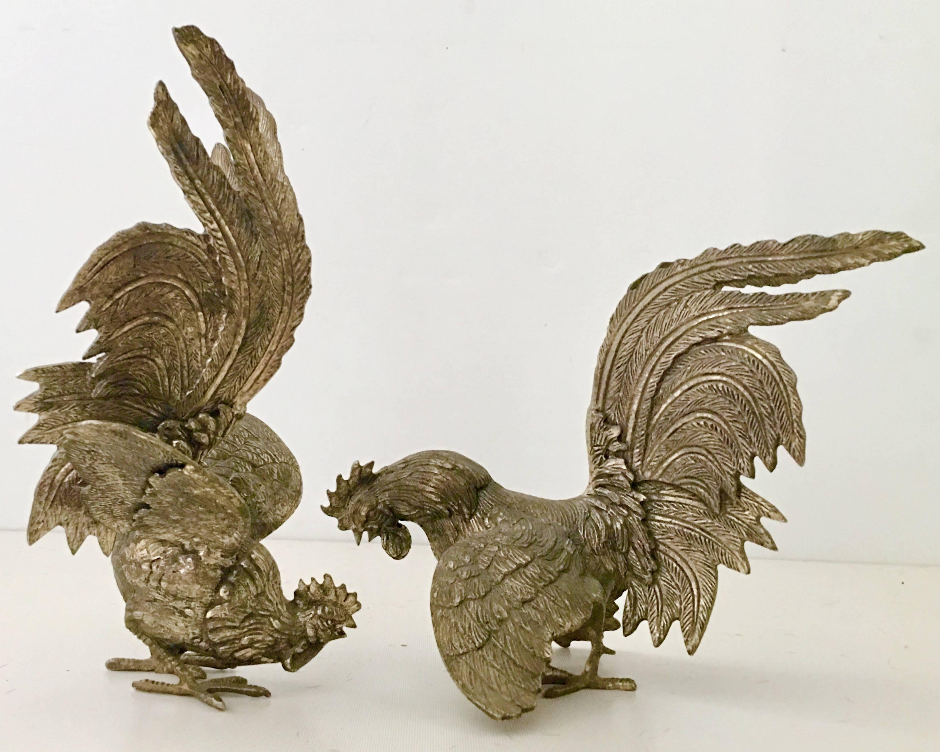 French pair of 19th century silver plate over solid brass "Fighting" cockerels/roosters. Hand chased and amazing attention to detail in creating the "in motion" state. This pair of cockerels are in the patina state and can be