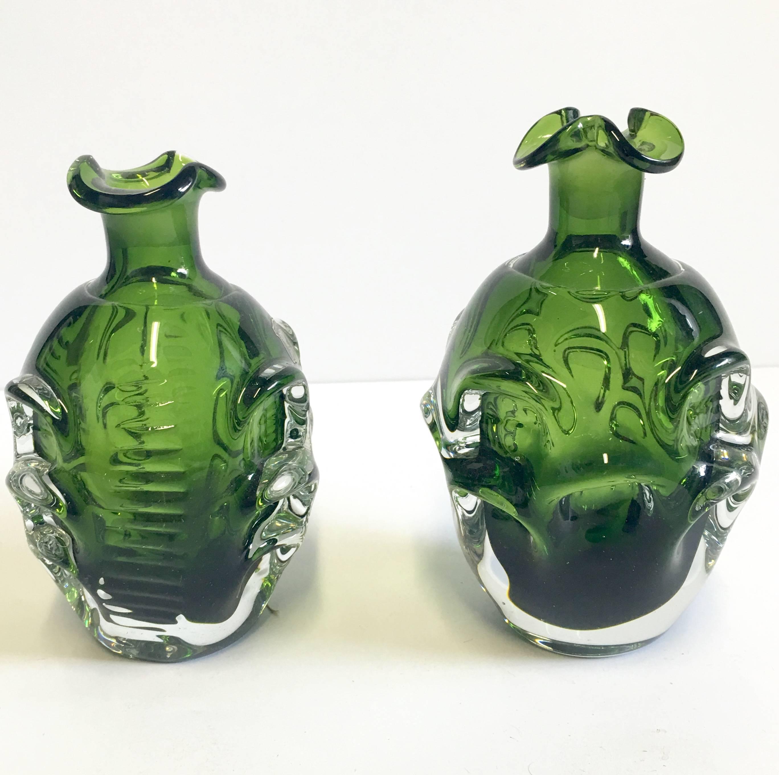 Mid-20th Century Emerald green textured blown glass Swedish decanter pair. Designed By, Bo Borgstrom for Aseda. The smaller decanter by .50