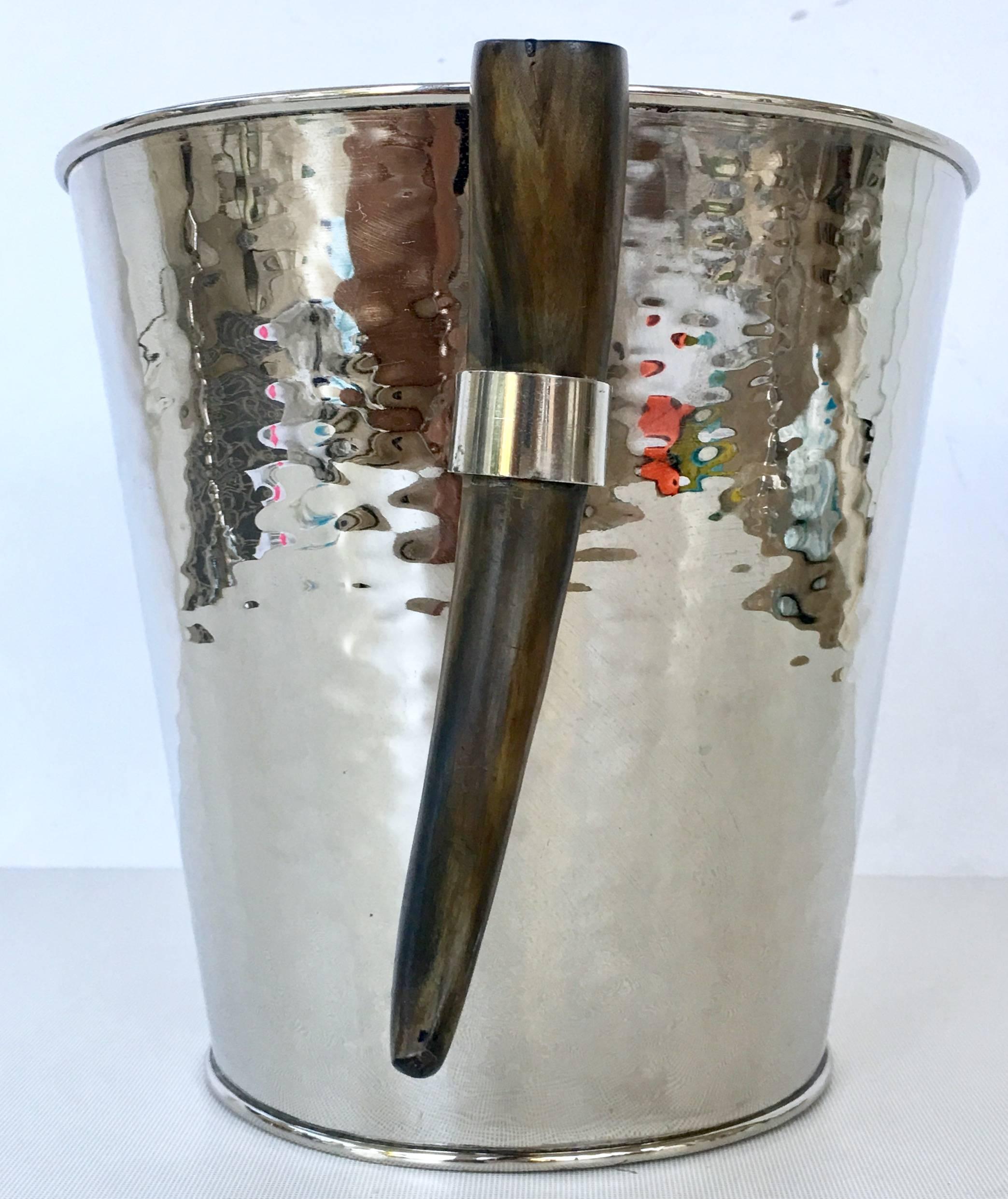 Contemporary & Modern hammered silver plate and Horn handle champagne or ice bucket.
New, floor sample.