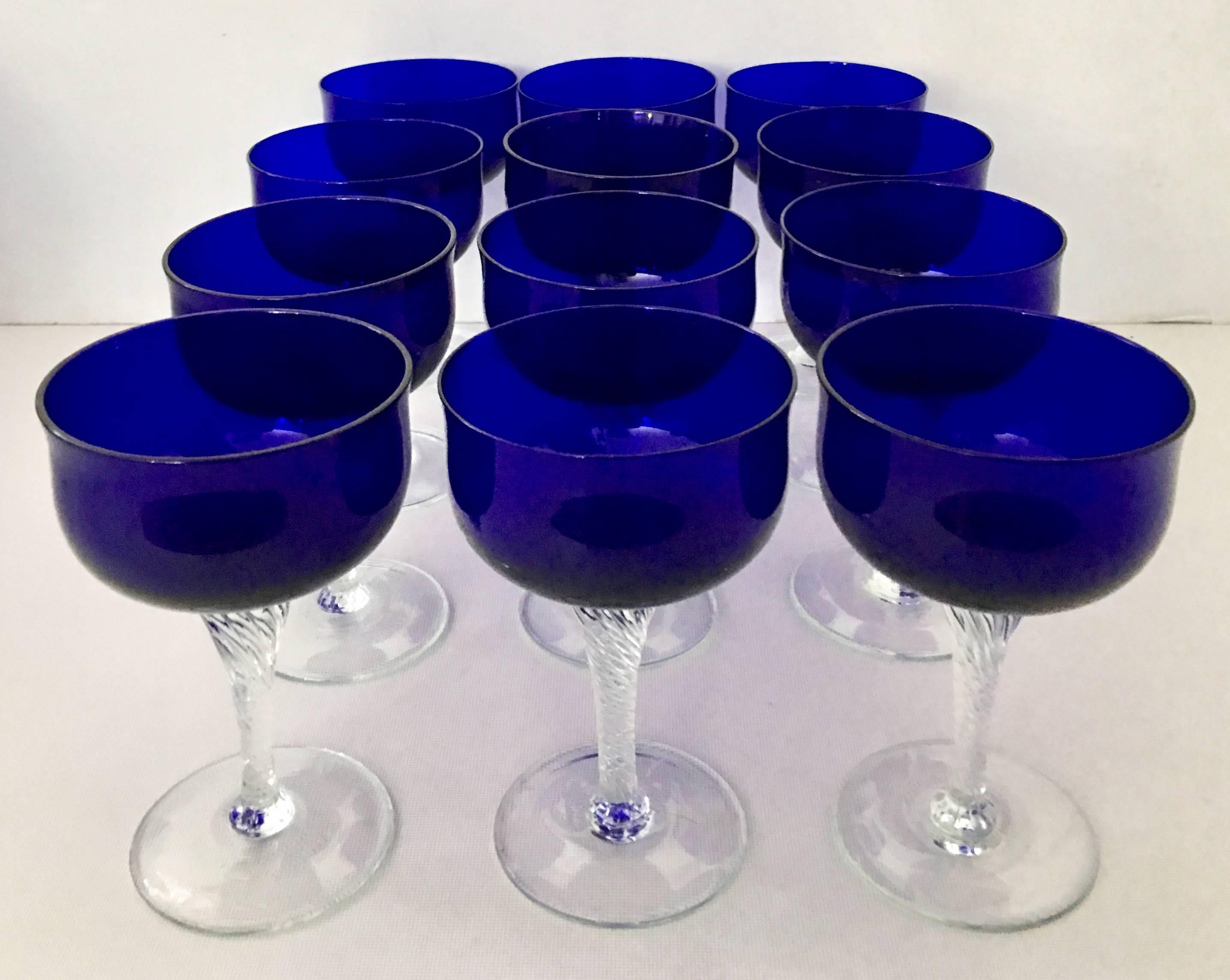 20th Century cobalt to clear coupe crystal stem glasses, set of 12 pieces by Sasaki.
These 12 coupe crystal glasses are in the 