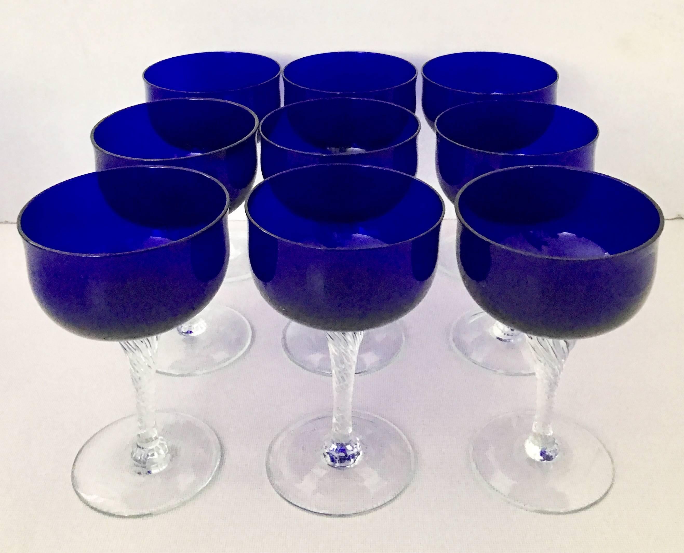 20th Century cobalt to clear coupe crystal stem glasses, set of nine pieces by Sasaki. The 