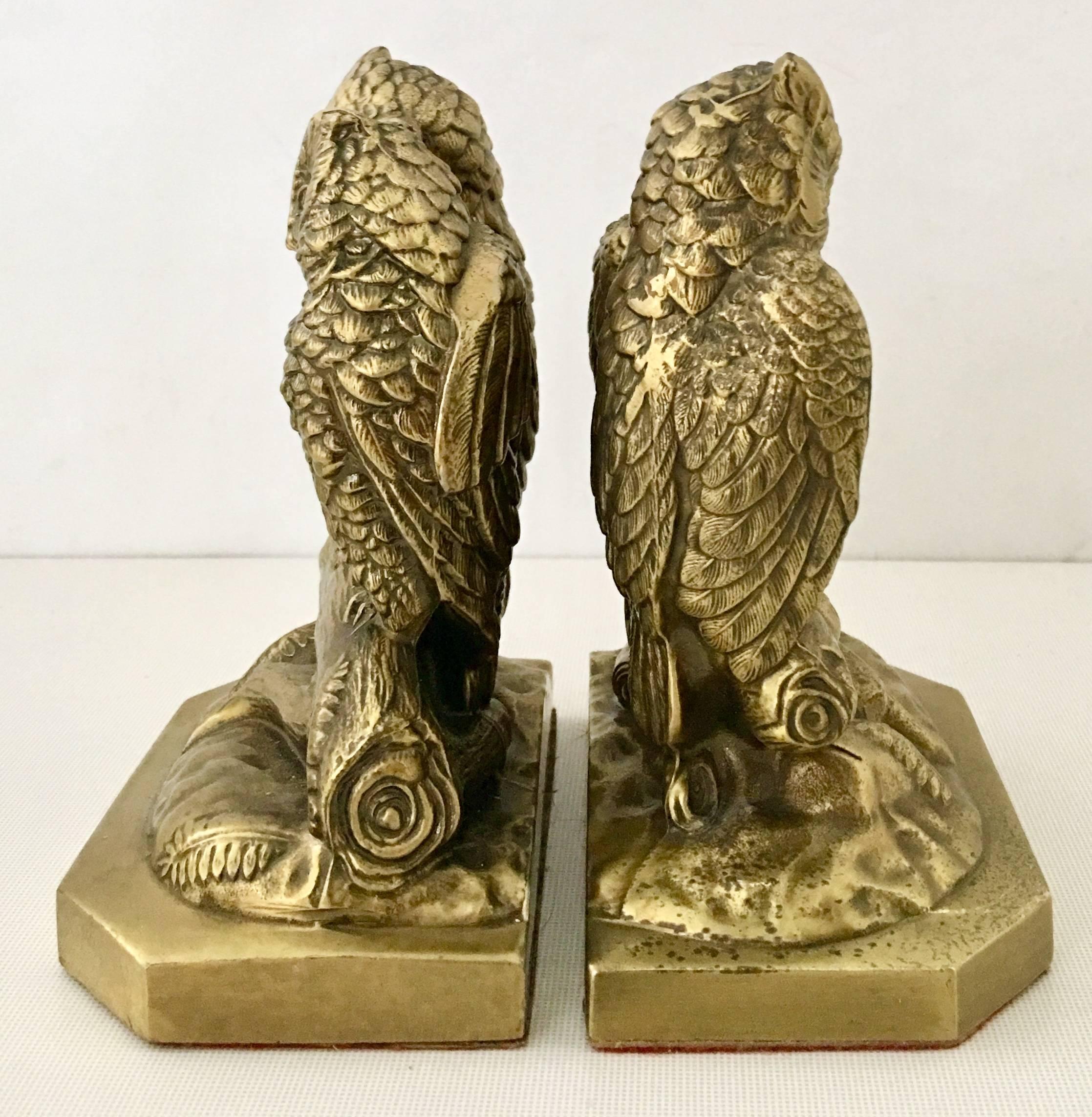 1950'S Pair of solid brass double couple owl book end sculptures. These rare brass owl bookend's each feature perched owl 