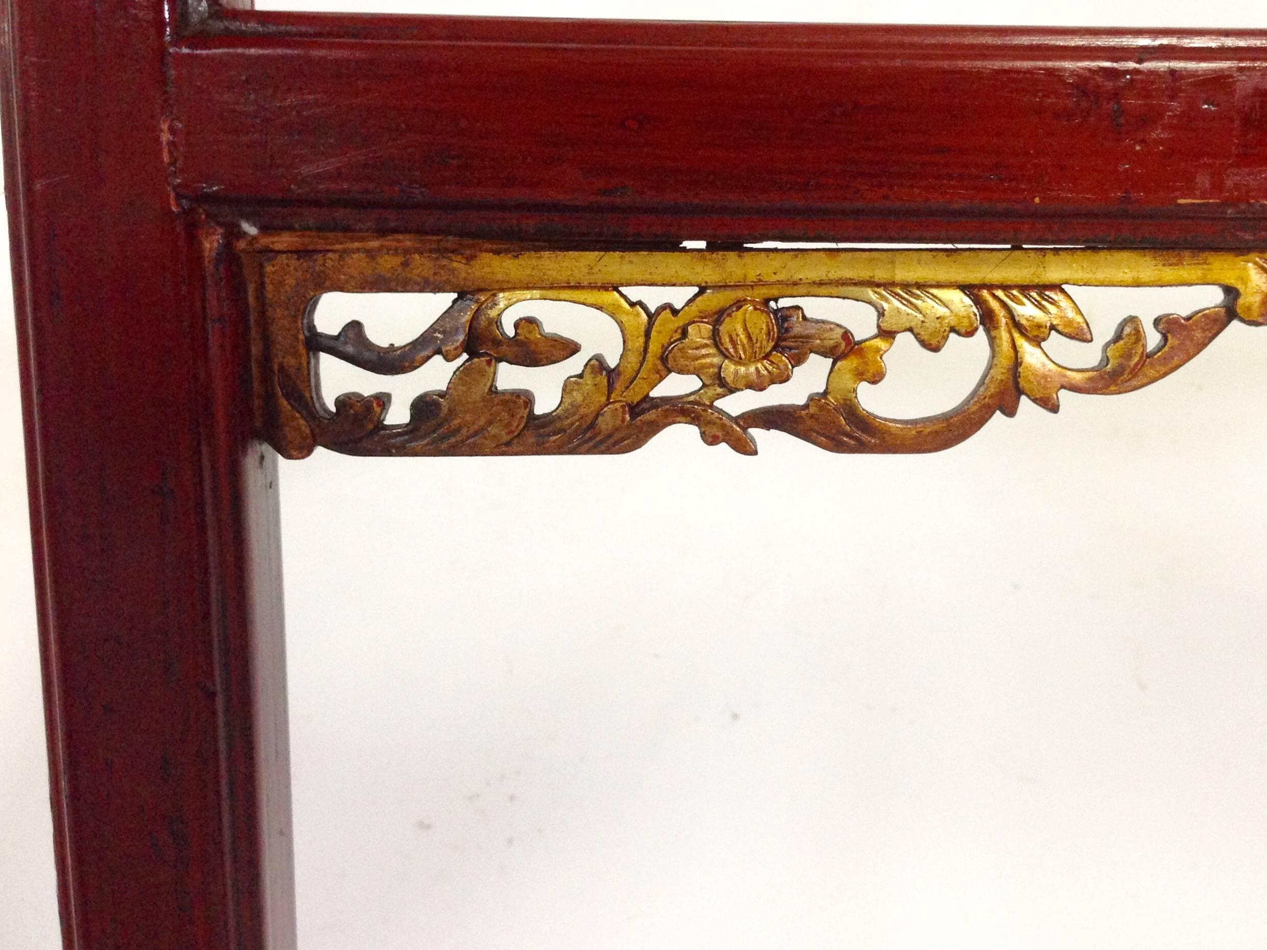This oversized, double-sided Chinese antique dragon garment rack is hand-carved, lacquered, and features gold-gilt dragons decorainge the end corners - indicating the master's high social ranking. Interesting fretwork and a high gloss finish make